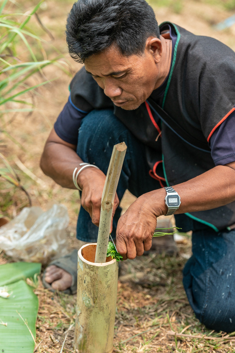 Adding fresh herbs to the cooking pot