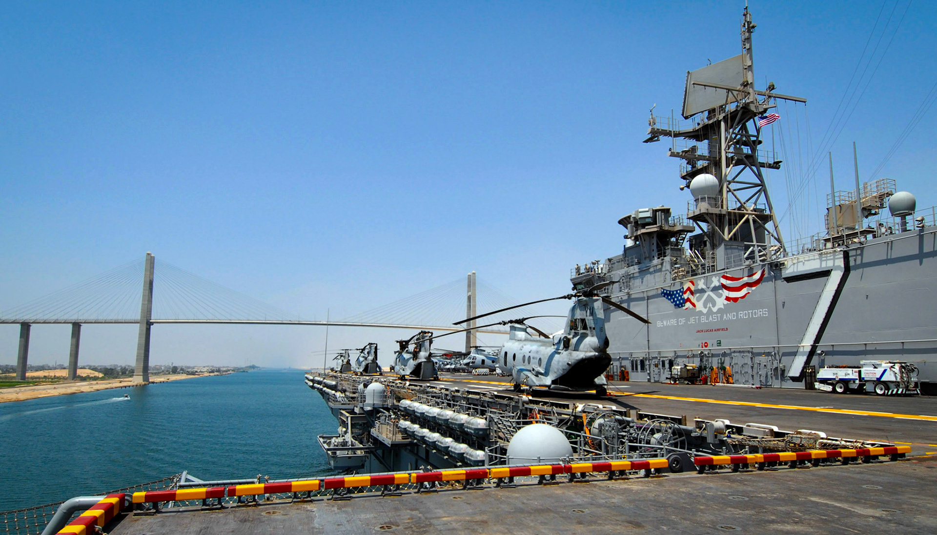 060720-N-4856C-008Suez Canal (July 20, 2006) – The amphibious assault ship USS Iwo Jima (LHD 7) prepares to pass under the Mubarak Peace Bridge during their transit through the Suez Canal. Iwo Jima was recently directed to assist in the departure of U.S. citizens from Lebanon. U.S. Navy photo by Mass Communication Specialist Seaman Christopher L. Clark (RELEASED)
