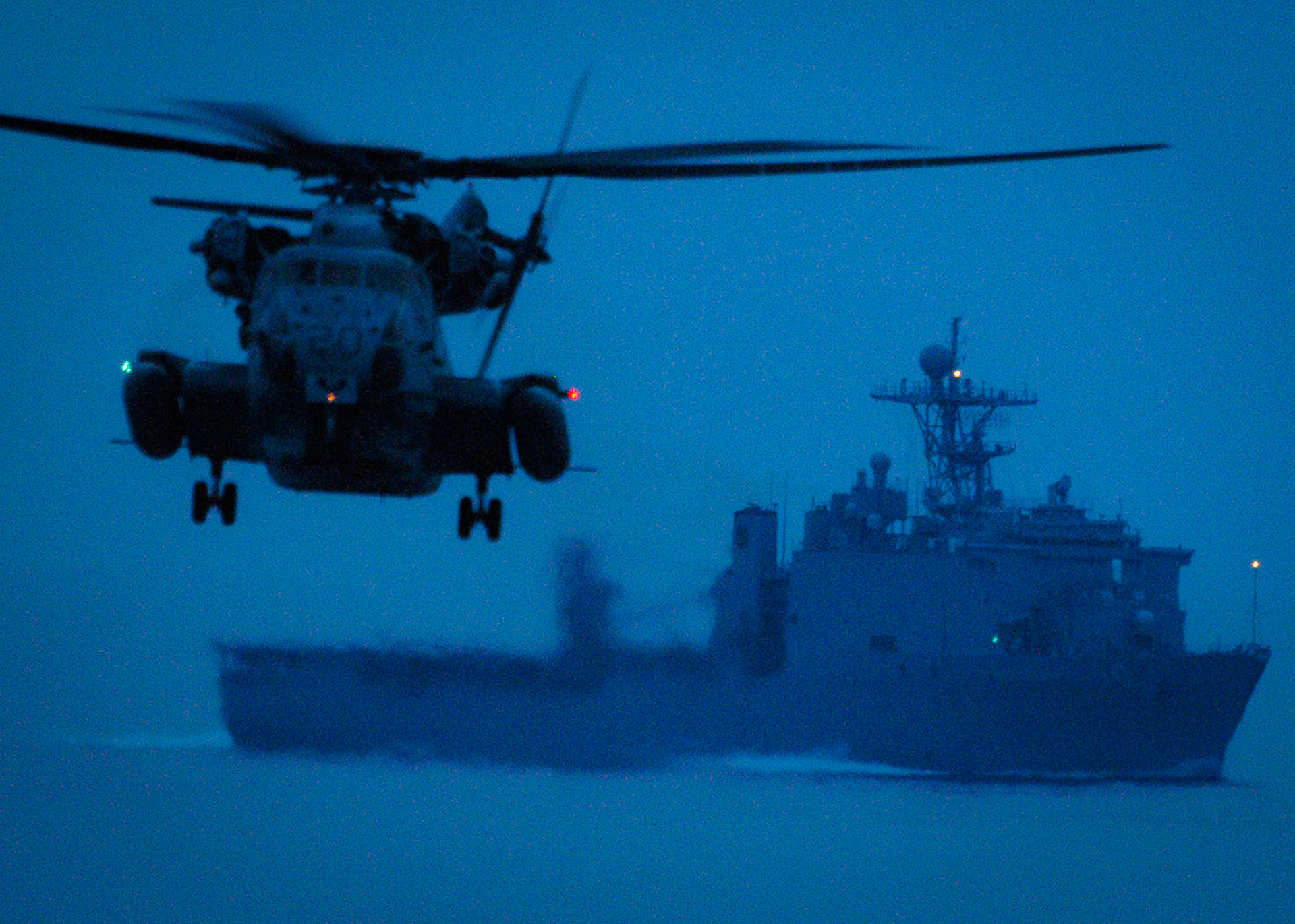 080714-N-4856C-022ATLANTIC OCEAN (July 14, 2008) A CH-53E Super Stallion conducts night flight operations near the amphibious dock landing ship USS Carter Hall (LSD 50) during the Iwo Jima Expeditionary Strike Group composite unit training exercise (COMPTUEX). COMPTUEX provides a realistic training environment to ensure the strike group is capable and ready for its upcoming deployment. U.S. Navy photo by Mass Communication Specialist Seaman Christopher L. Clark (Released)