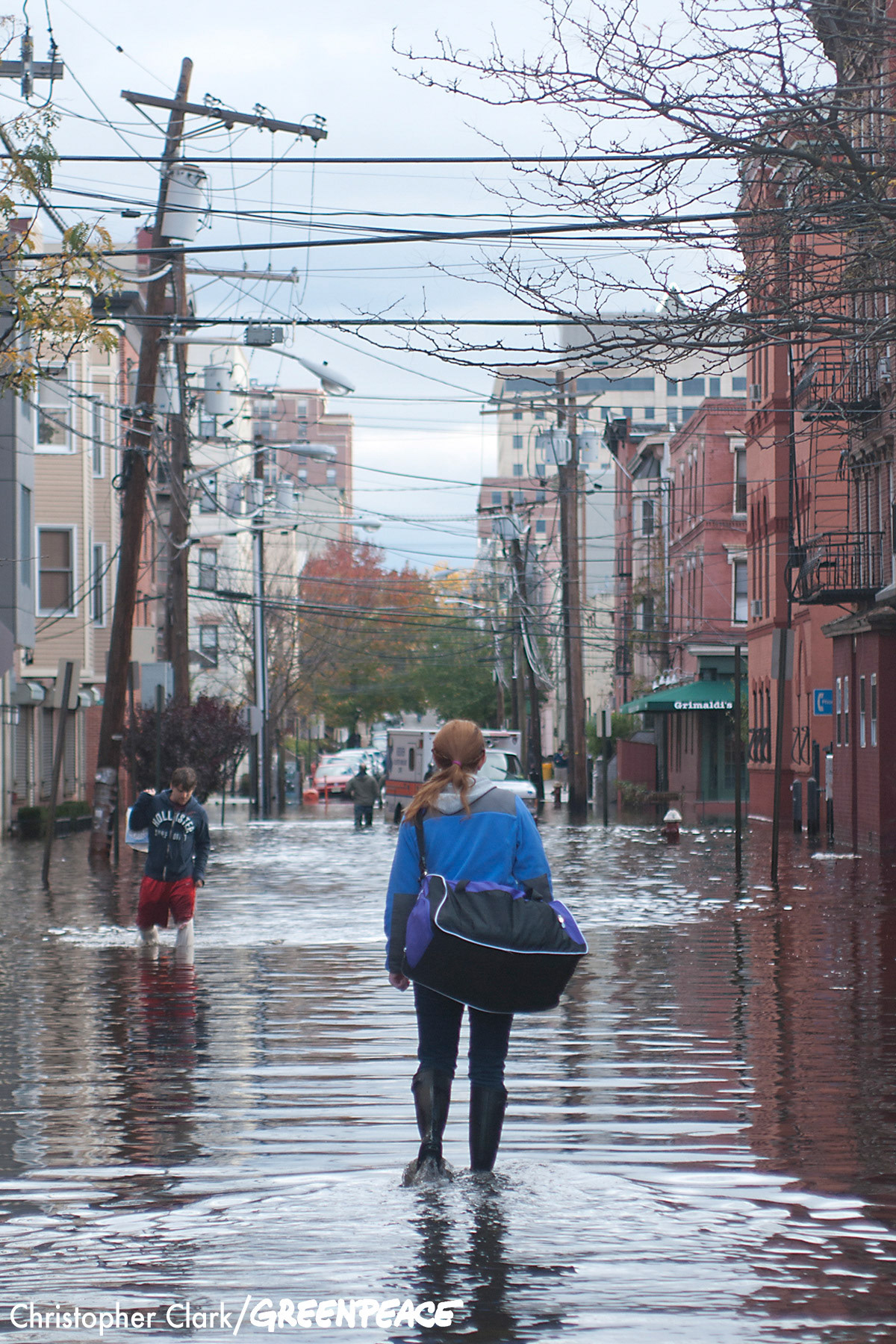 A woman walks through the flooded streets of Hoboken, New Jersey in the aftermath of hurricane Sandy on October 31st, 2012.