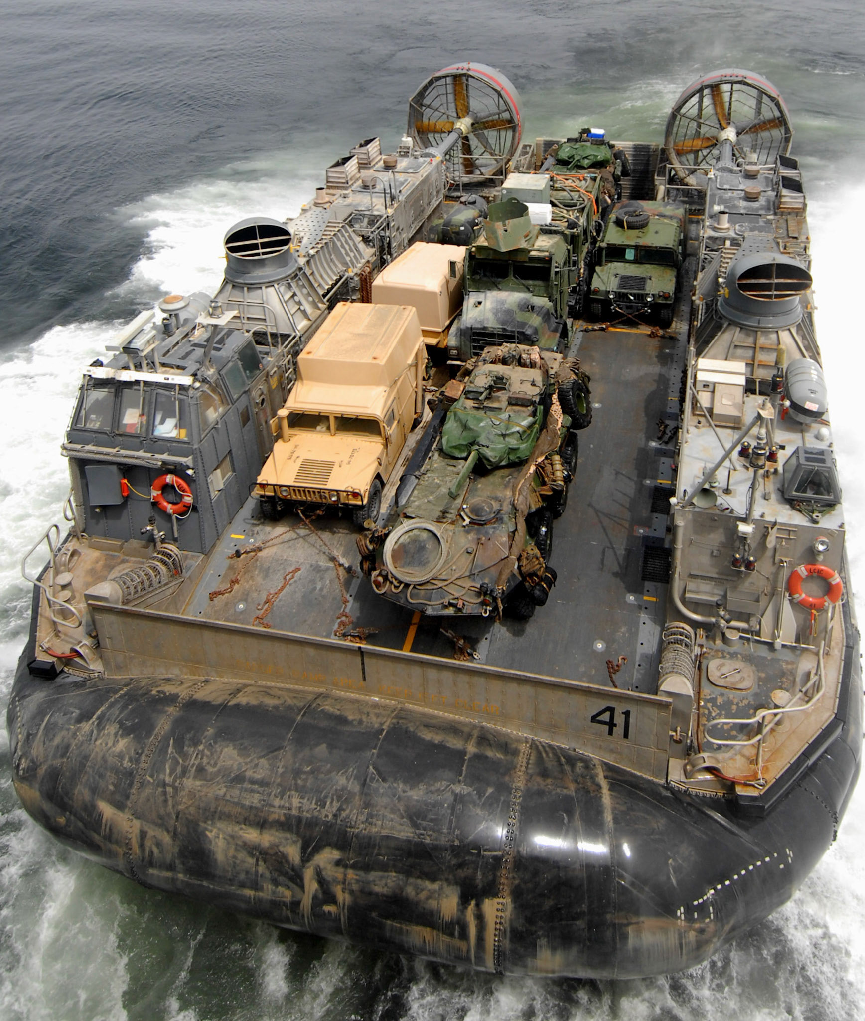 Aboard USS IWO JIMA LHD 7 (Sept. 21, 2006) -- A Landing Craft Air Cushioned (LCAC) leaves the ship's well deck aboard USS Iwo Jima (LHD 7) September 21.  Iwo Jima recently deployed from her homeport of Norfolk, Va., and began a regularly scheduled six-month deployment to the U.S. European Command and U.S. Central Command (CENTCOM) areas of responsibility (AOR) to conduct Maritime Security Operations (MSO)U.S. Navy photo by Mass Communications Specialist Seaman Christopher L. Clark