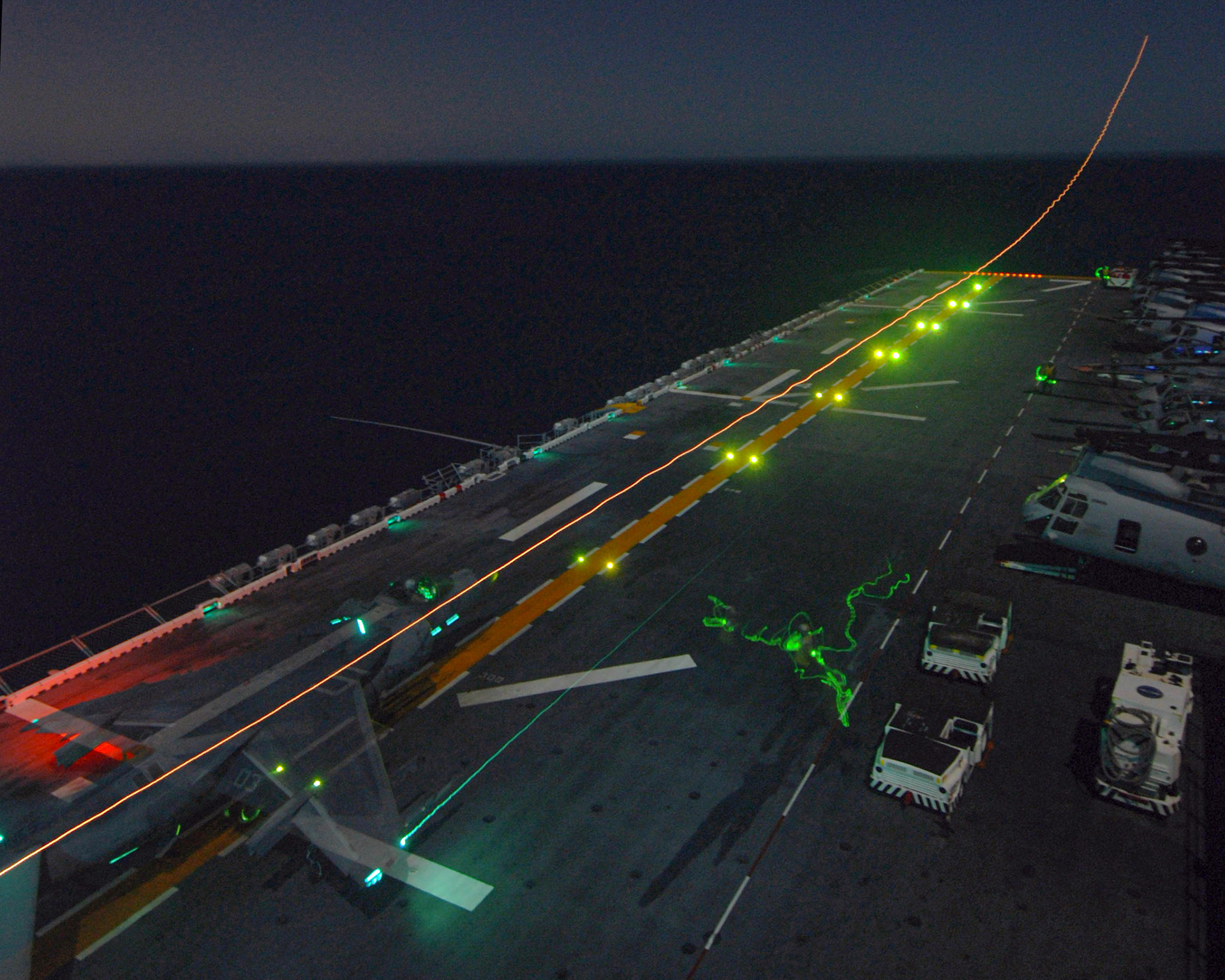 ABOARD USS IWO JIMA (LHD 7) - An AV-8B Harrier launches from the flight deck during night vision flight operations aboard USS Iwo Jima (LHD 7). The multi-purpose amphibious assault ship is currently underway conducting training in preparation for deployment.U.S. Navy photo by Mass Communications Specialist Seaman Christopher L. Clark (RELEASED)
