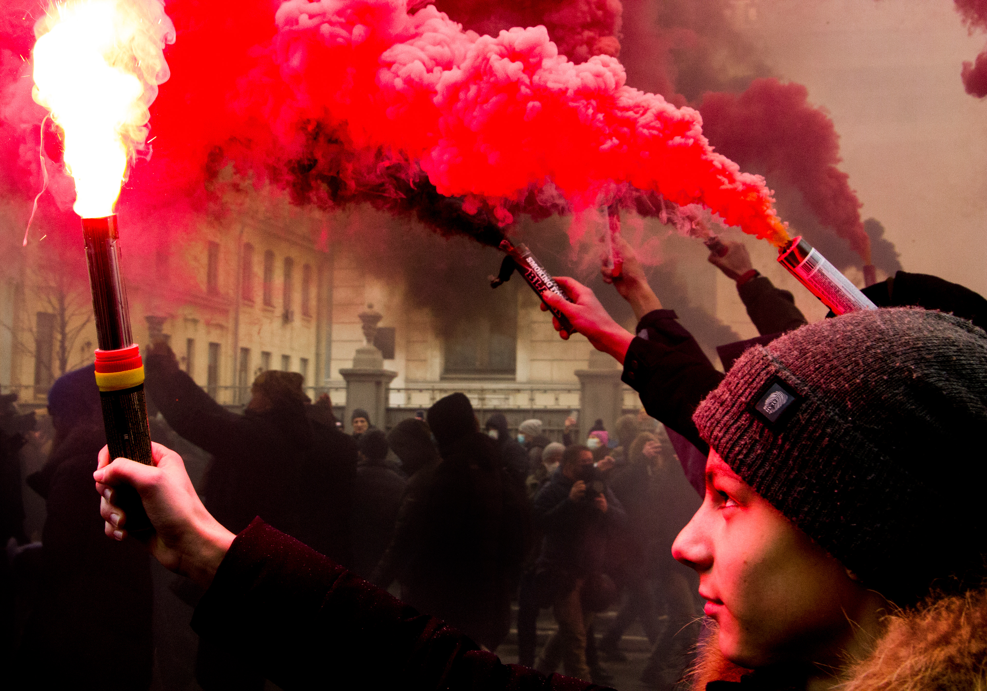 Teenagers protesters burn flares during a rally in support of the dismissal of Minister of Internal Affairs of Ukraine Arsen Avakov outside Verkhovna Rada, 2021.