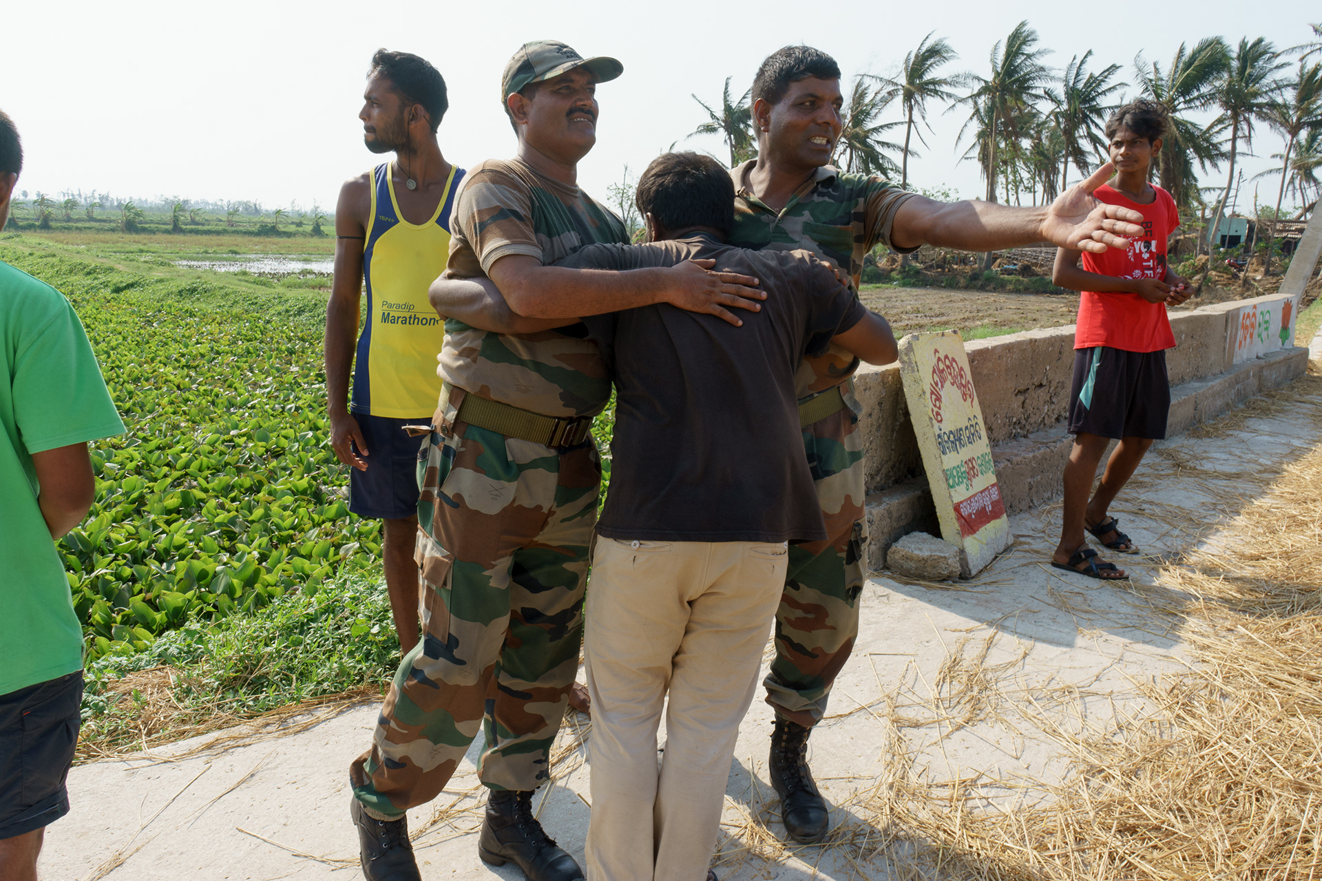 Grateful for their relief efforts, one of the on-ground volunteers, Aditya Kiran hugs the two army men.