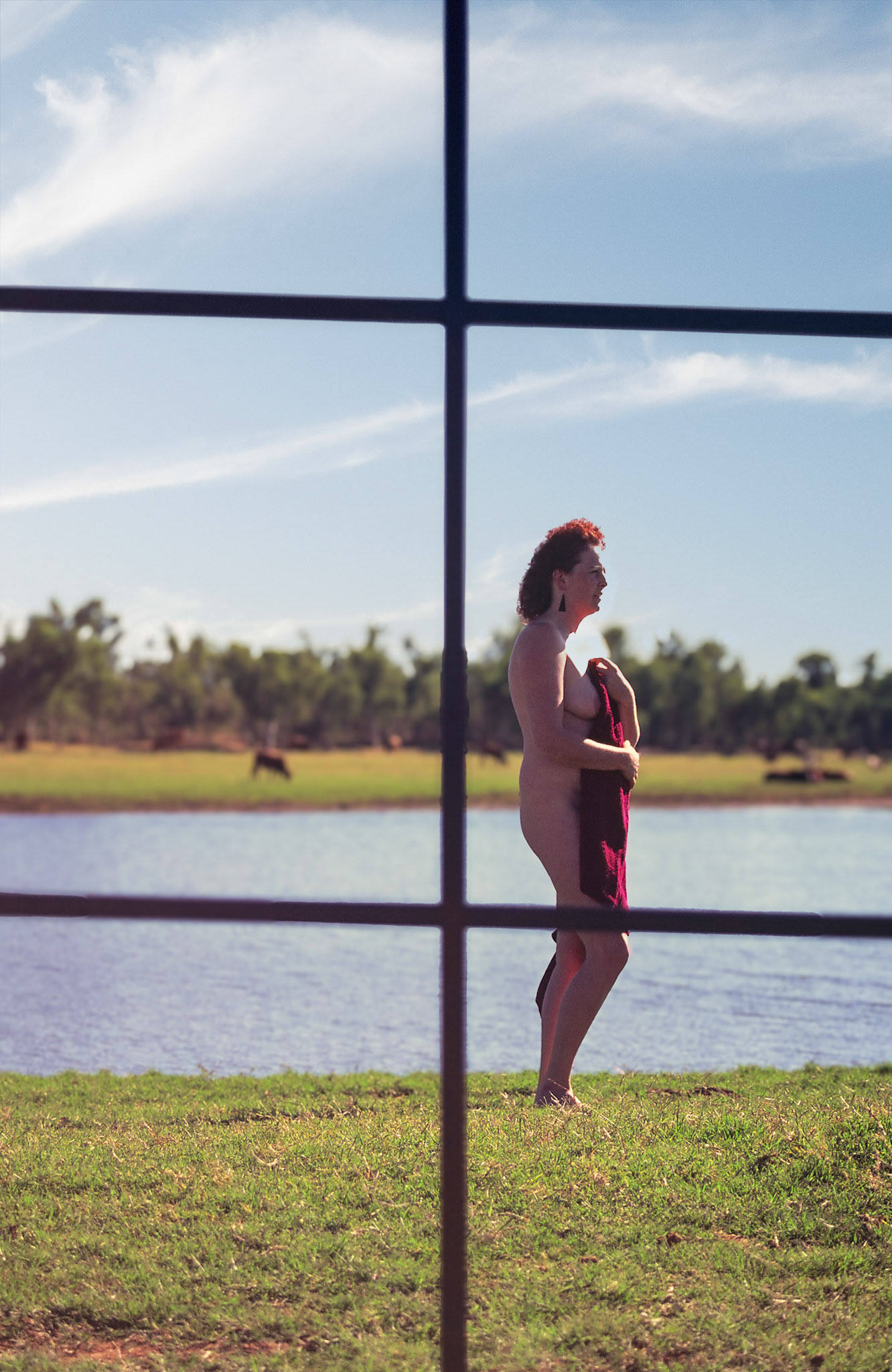 woman through window at lake
