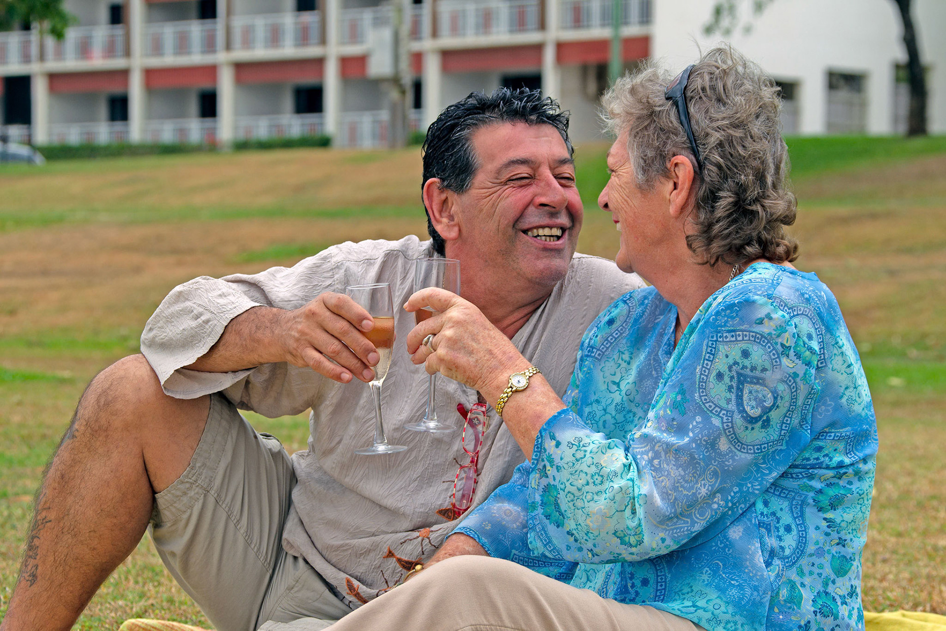 couple sitting grass toasting bubbly© copyright-lewis-a-collins-lcpmtl-! http://lewiscollins.com.au
