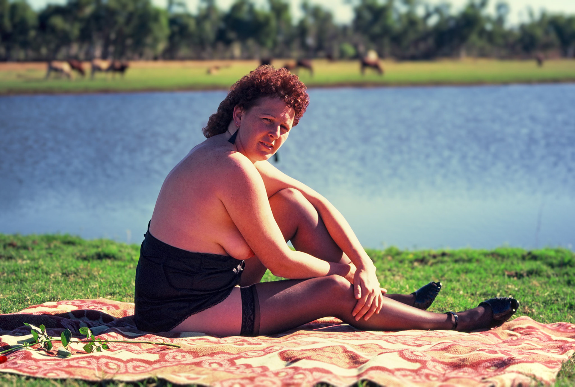 woman enjoying sunshine at lake