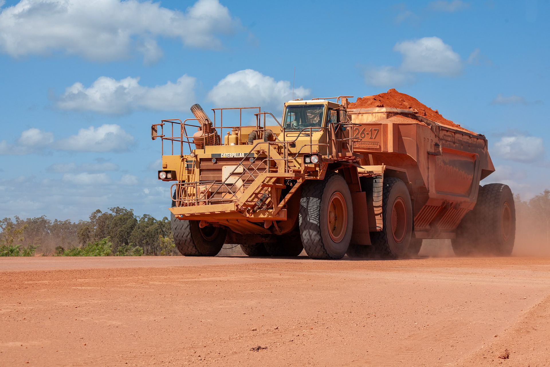 2008 july number 5 huge mining truck passing loaded with bauxite caterpillar, weipa, cape york peninsula, Queensland Australia© copyright lewis a collins ! http://lewiscollins.com.au