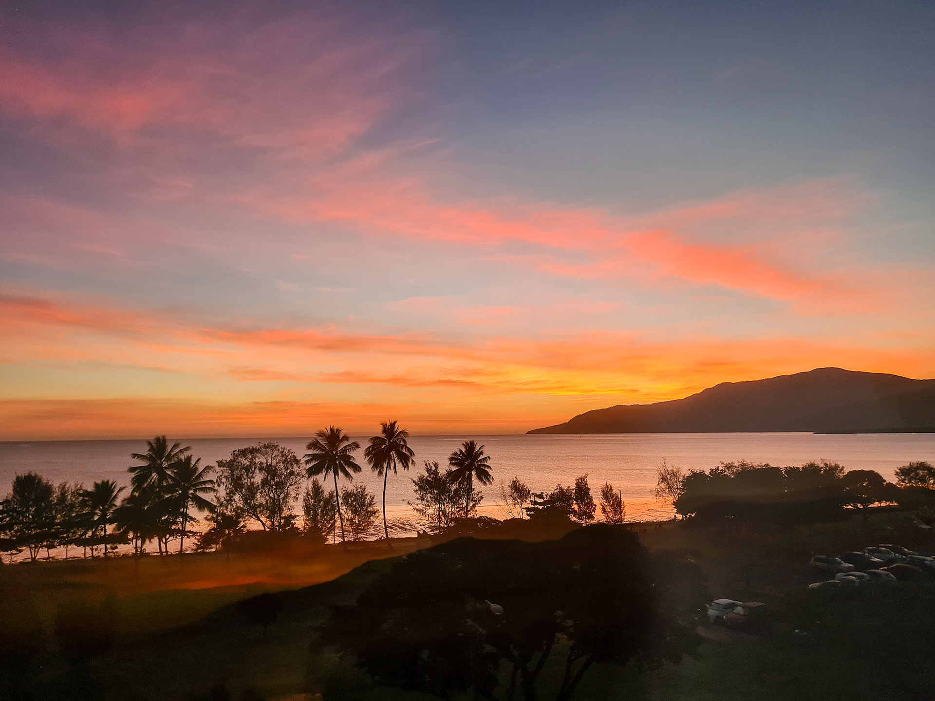 Beautiful orange sunrise glow on a tropical Cairns North the Esplanade Queensland Australia© copyright lewis a collins ! http://lewiscollins.au