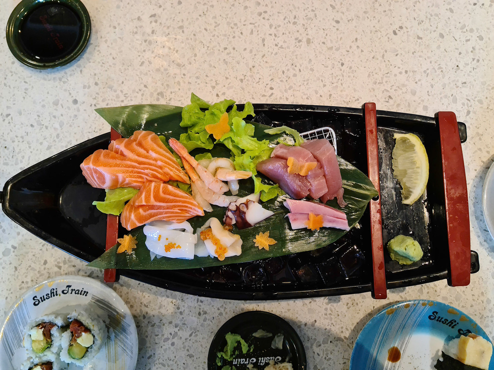 Fanstic lunch a Sushi Train Boat Kingfish Pink amaebi sweet prawns  Tako(octopus) Ika(squid) and so much more at Sushi Train restaurant, Cairns QLD Australia
