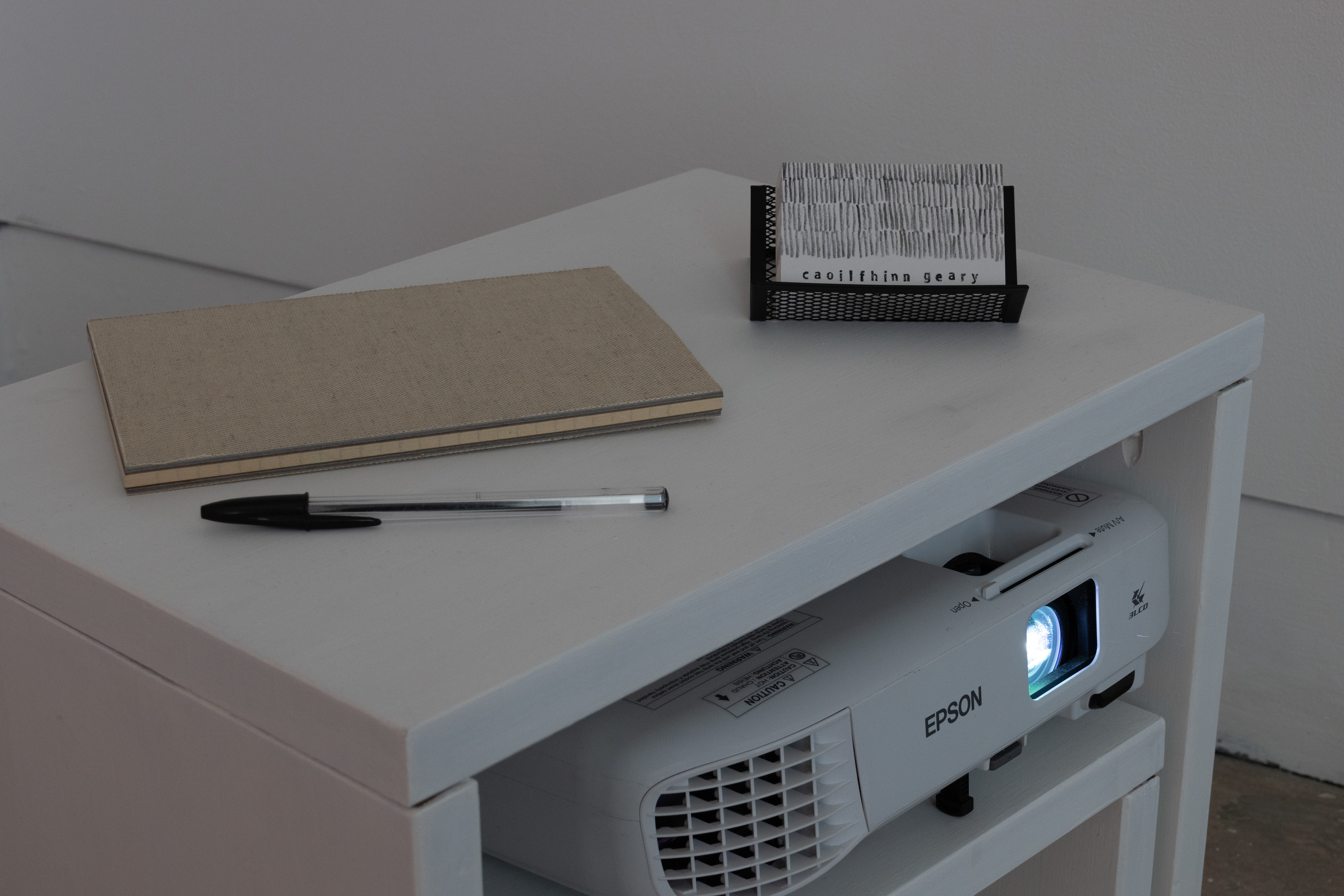 Upcycled side table, projector and public notebook