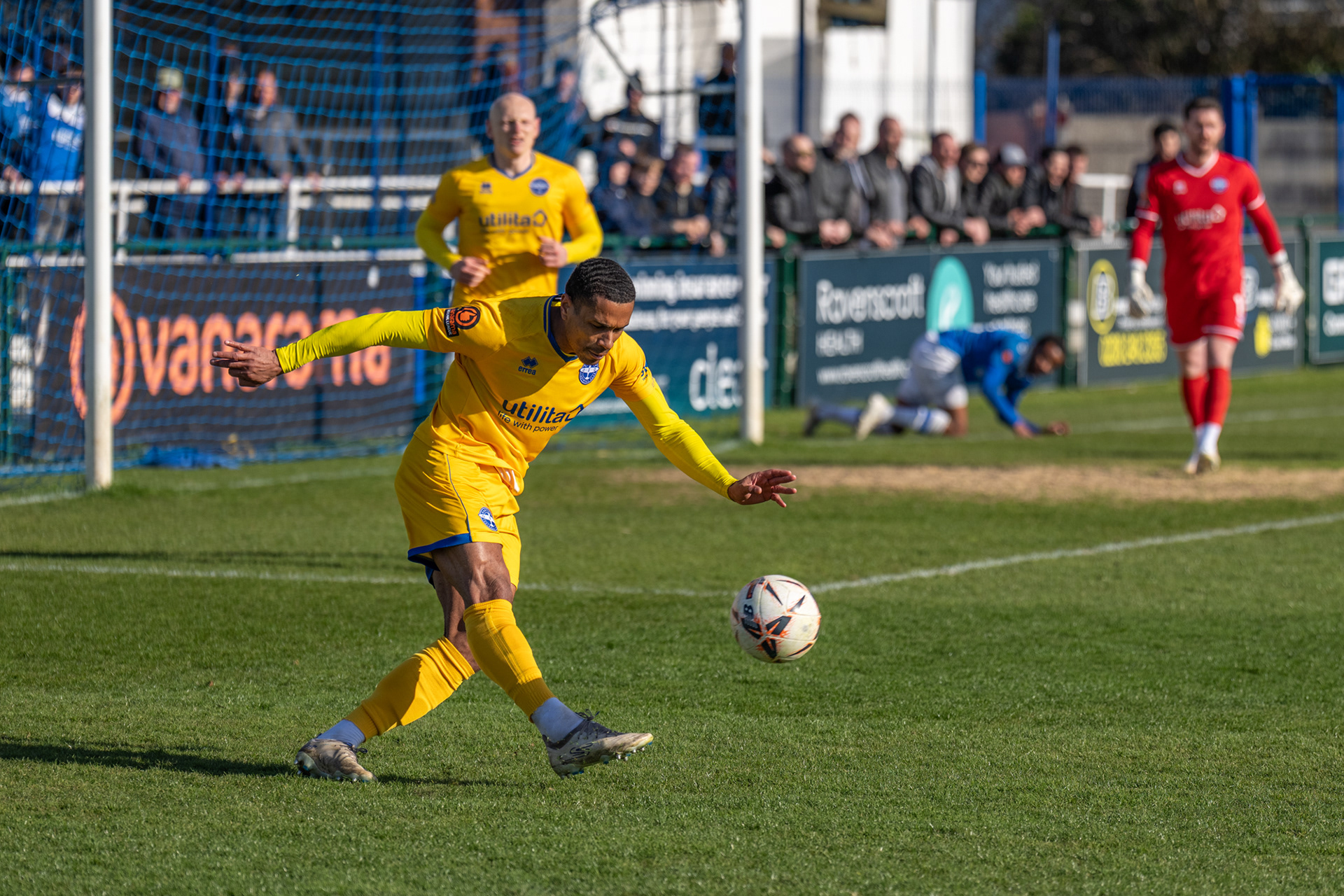 Eastleigh defender Brindley clears the danger