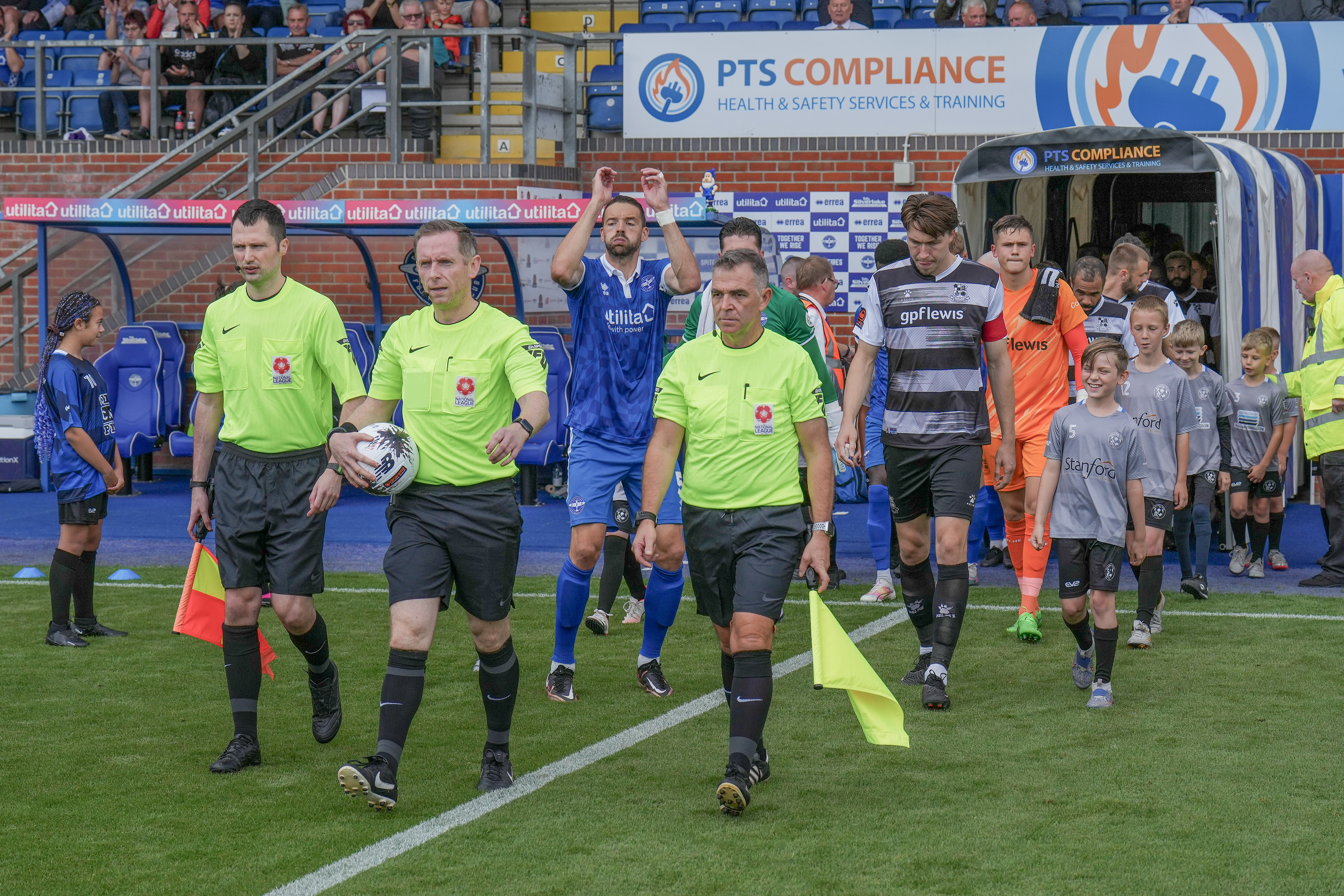 Officials lead the teams out