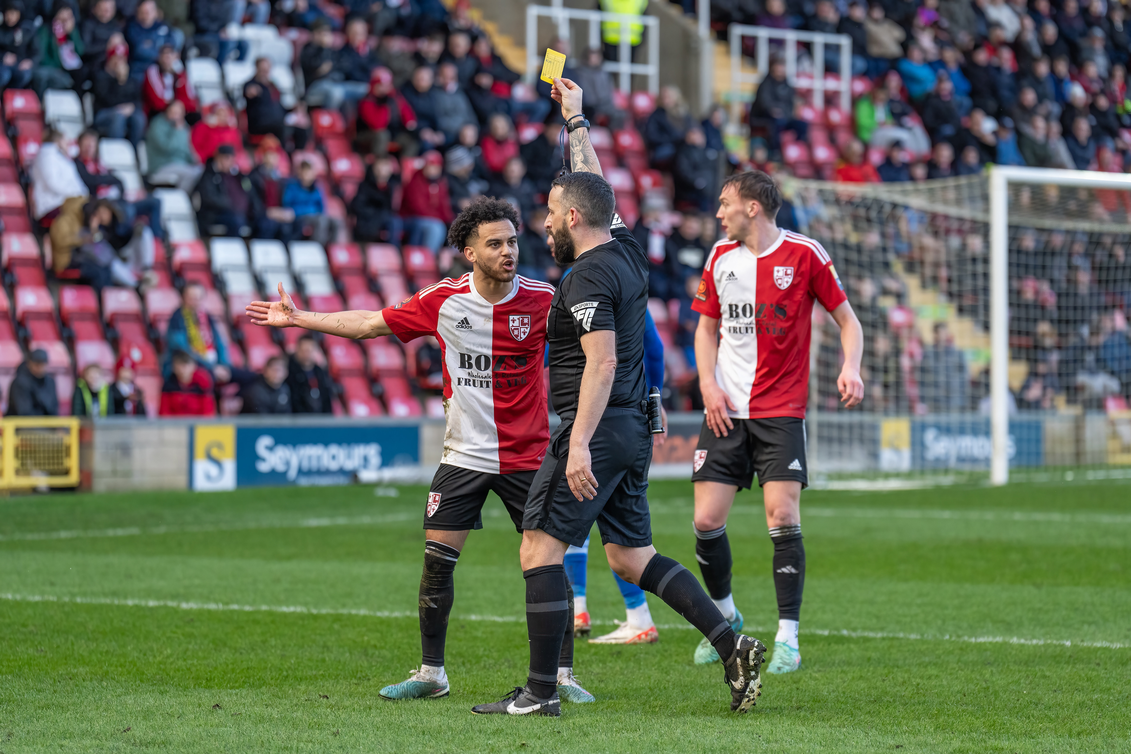Dion Kelly-Evans protests his yellow card