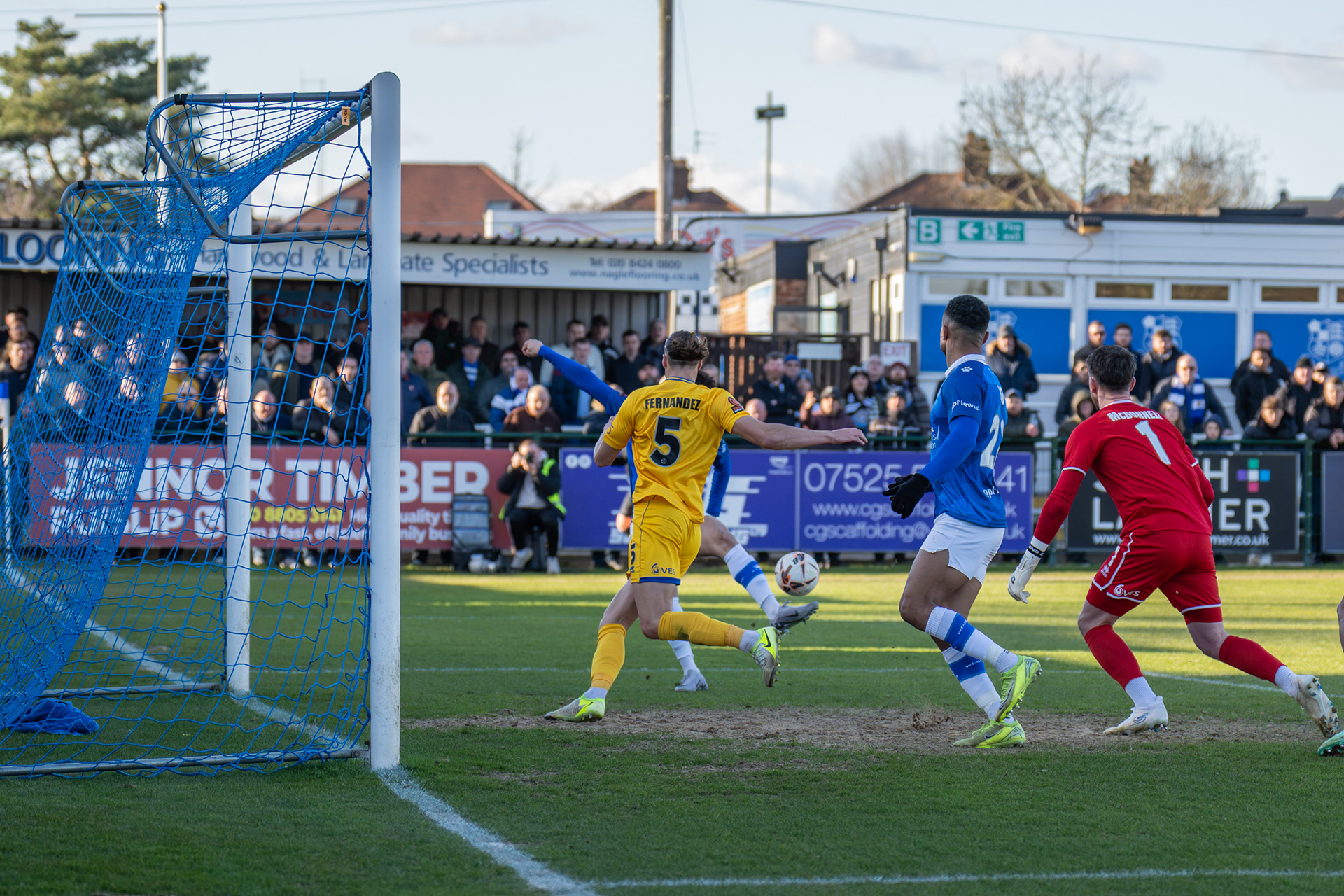 Tyler Walker (obscured) connects with Mustapha Carayol's cross.....