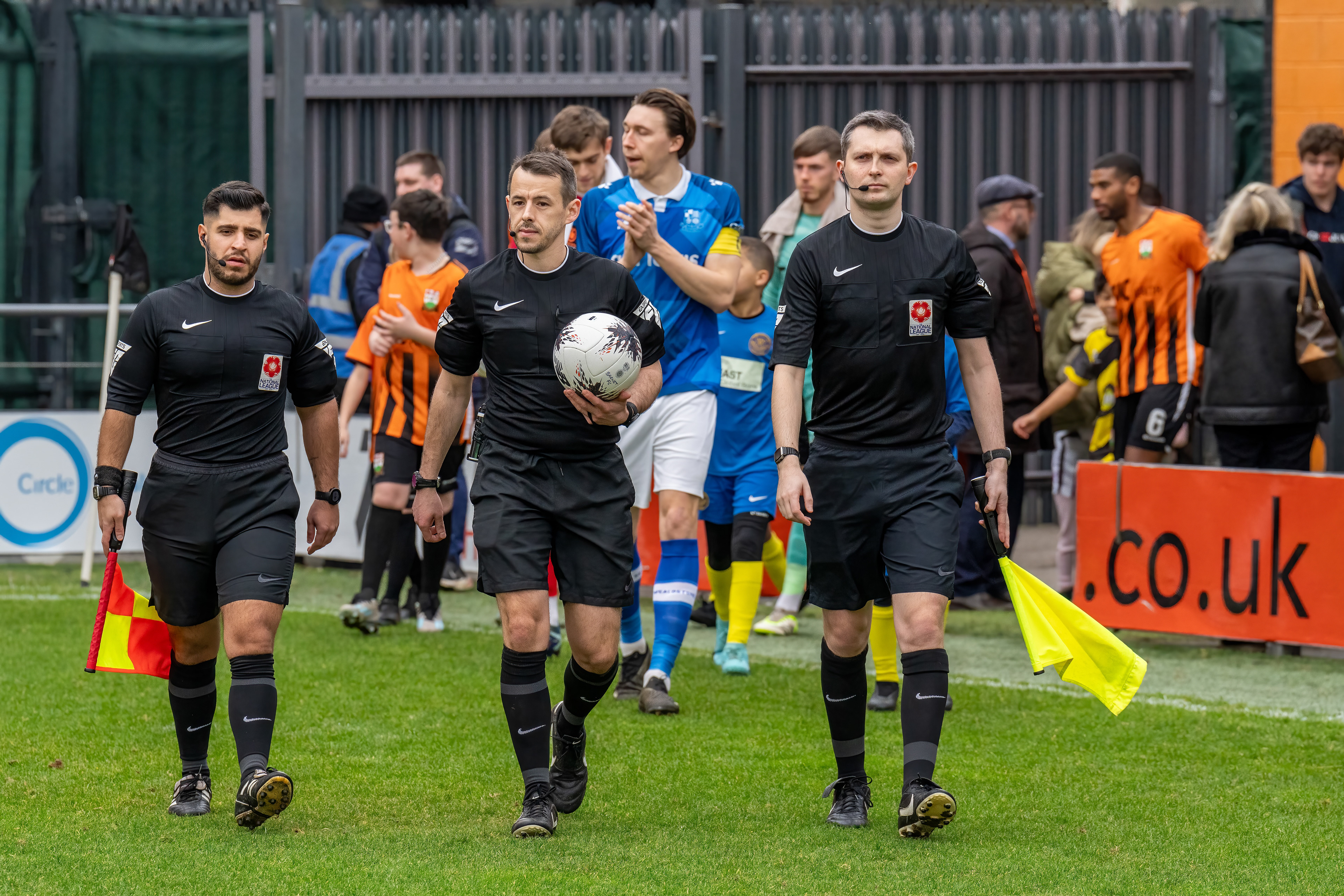 Officials leading out the teams