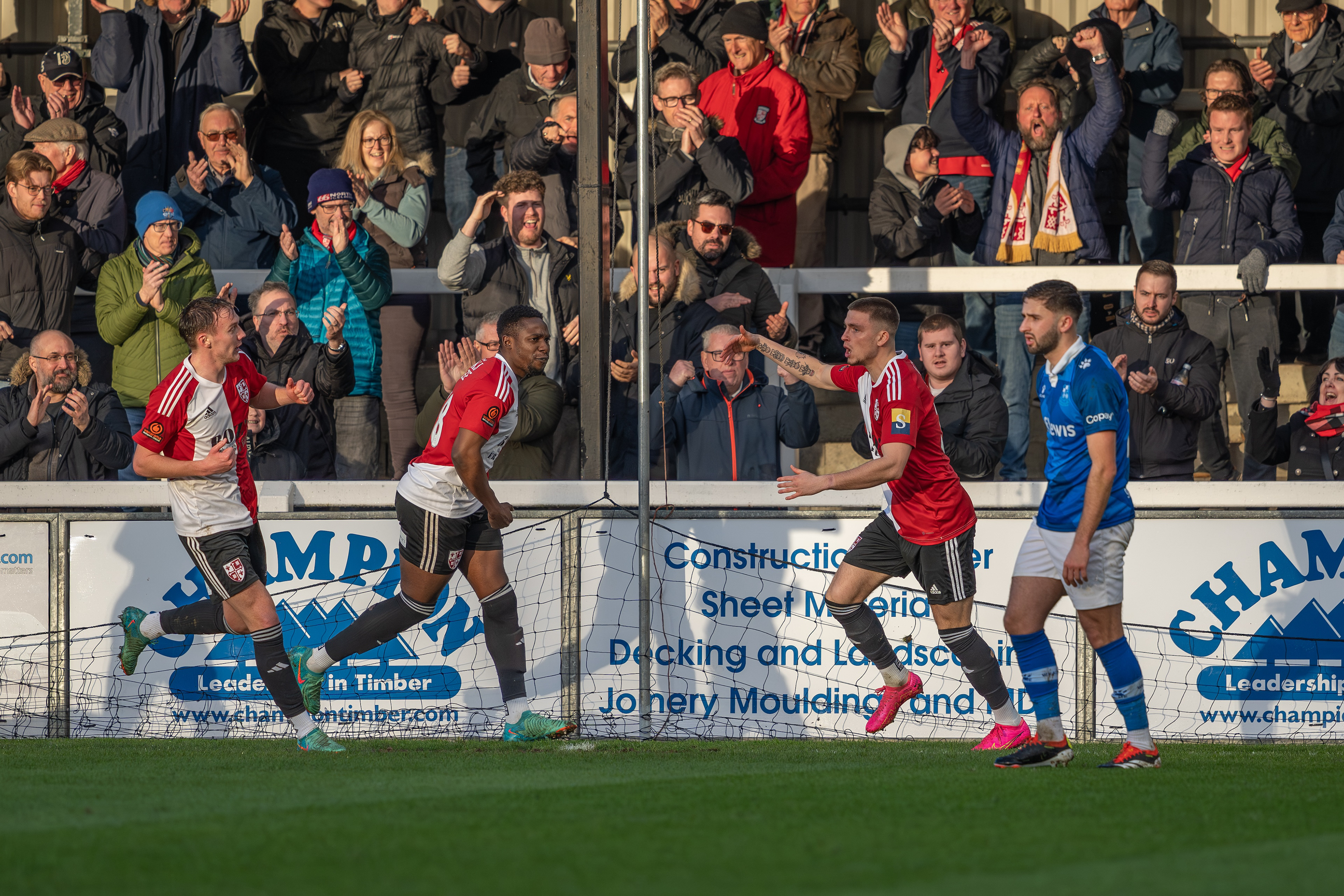 Charley Kendall celebrates Woking's equaliser