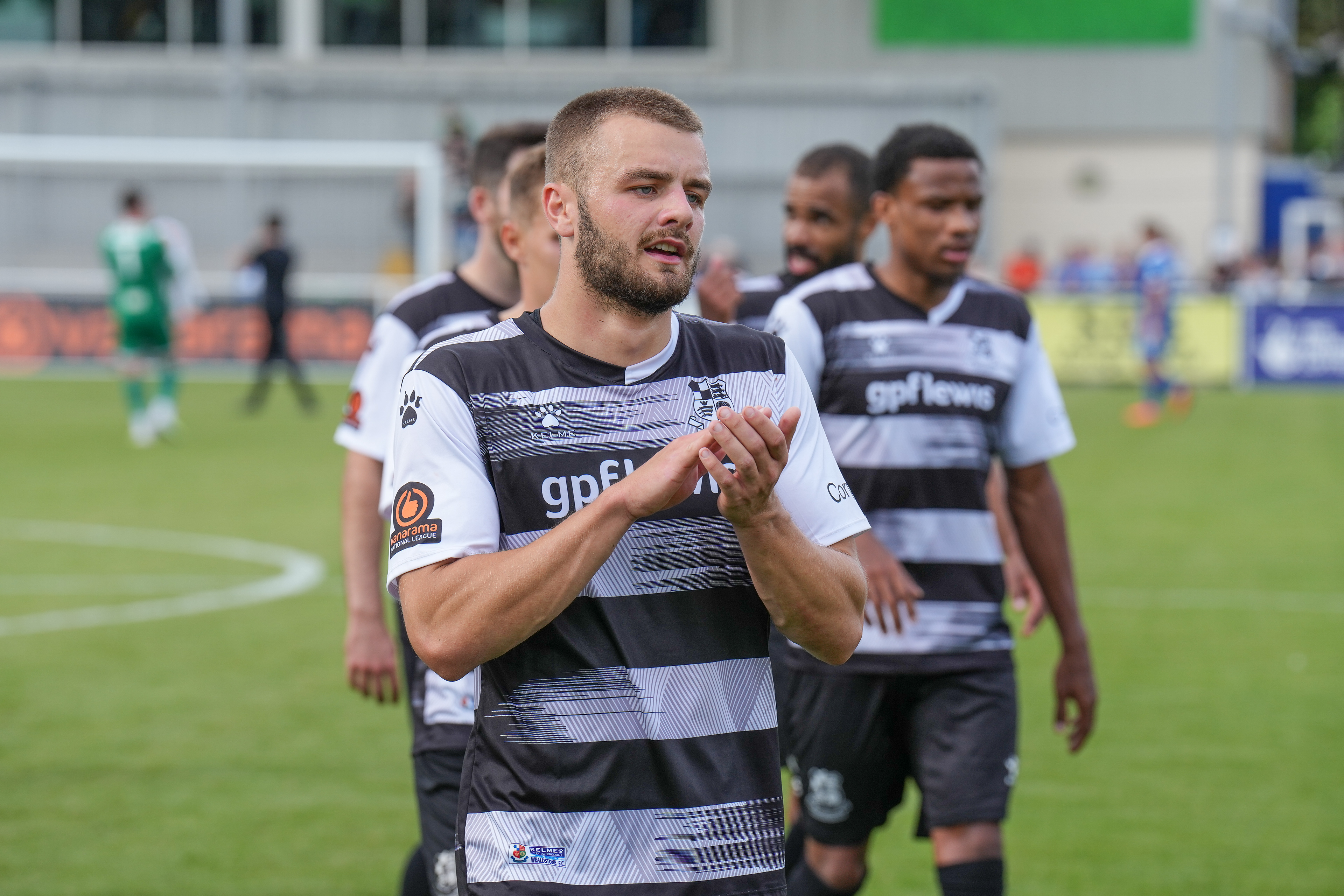 Charlie Barker applauds the fans