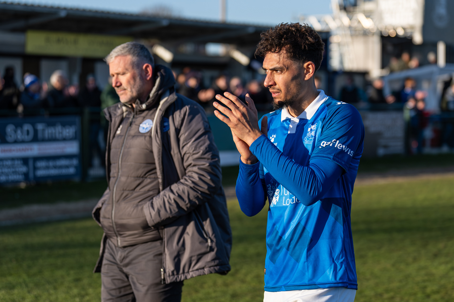Tyler Walker applauds whilst Kelvin Davis ponders what went wrong