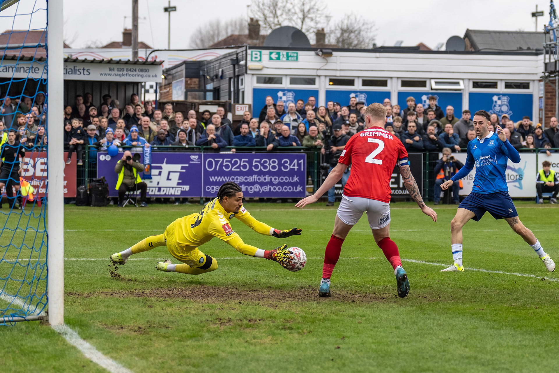 Jack Wells-Morrisons shot is turned towards goal by Sam Ashford....