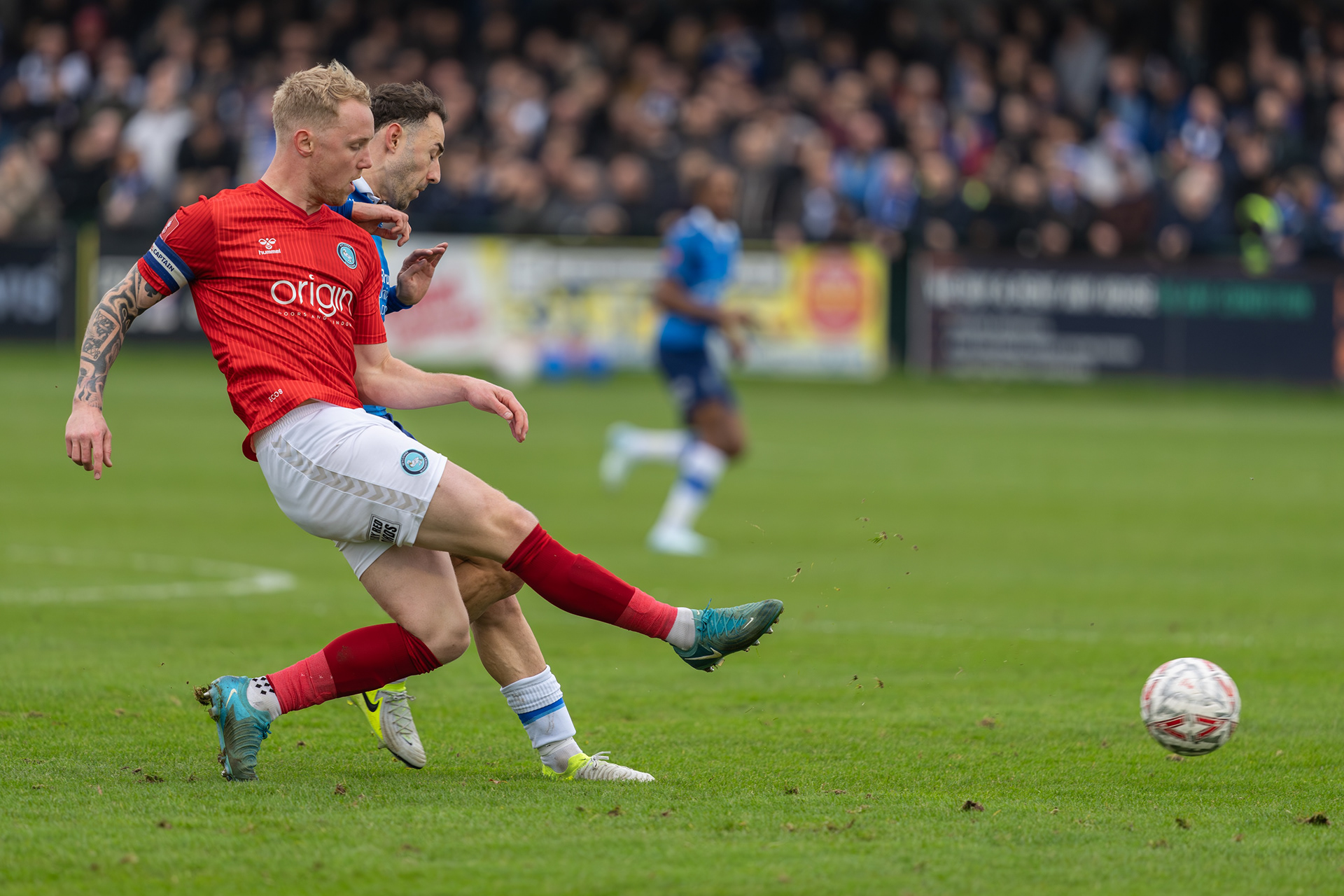 Sam Ashford challenging Jack Grimmer for the ball