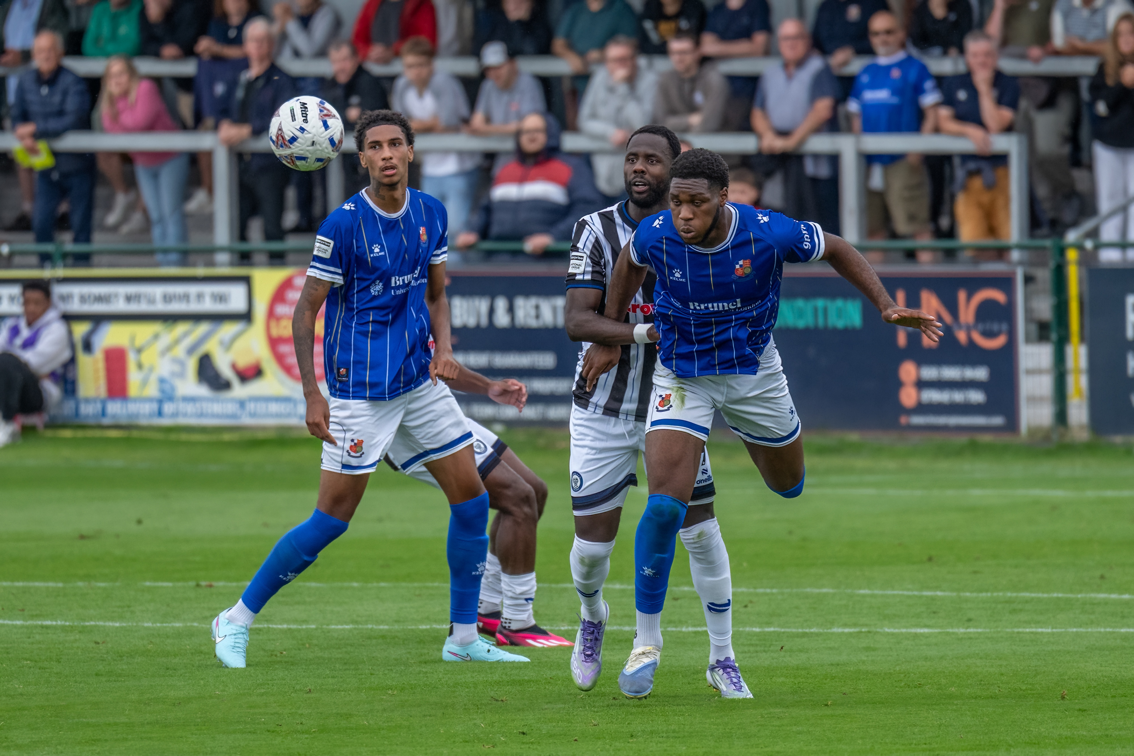 Phillip Chinedu powers away a header