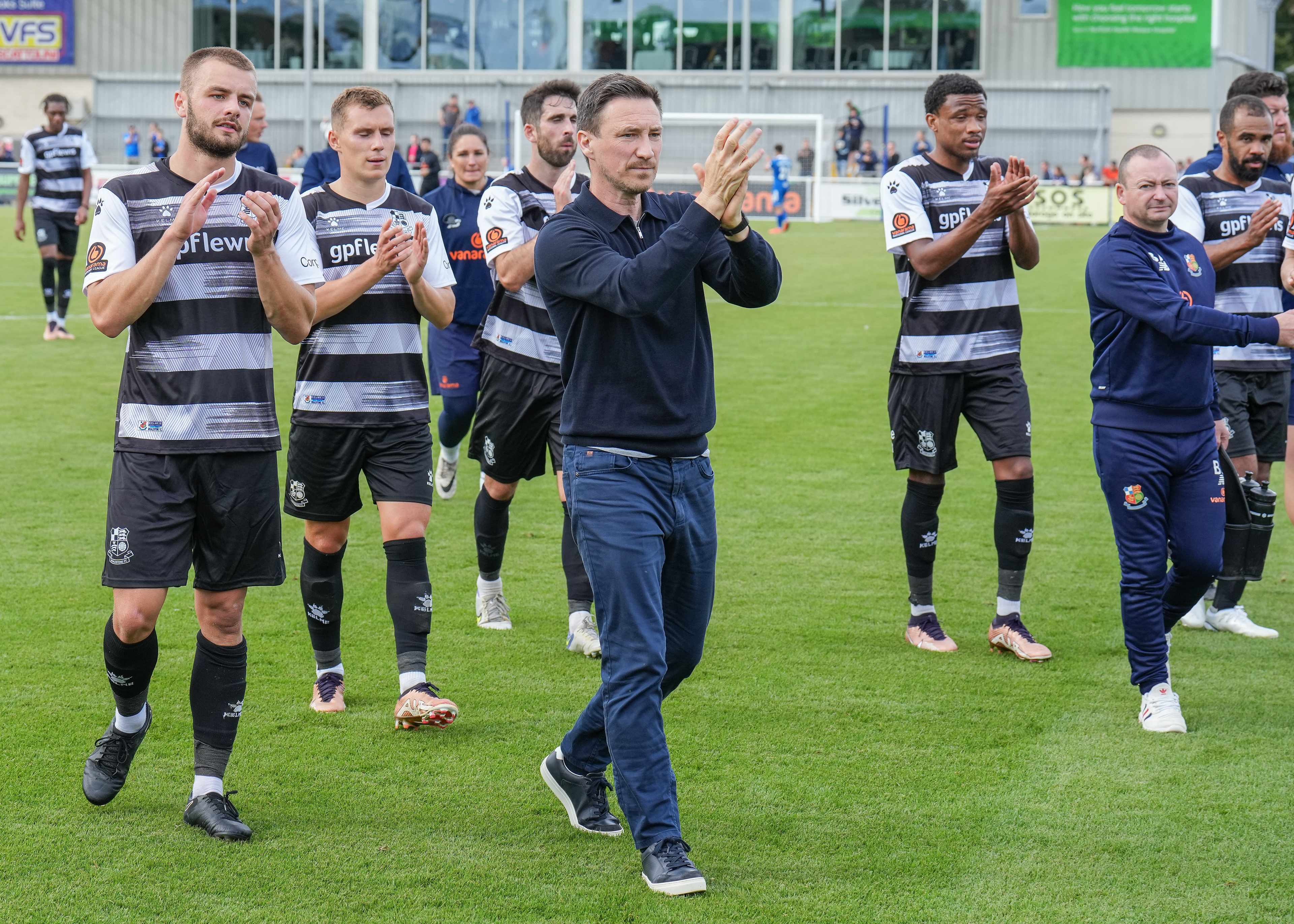 Stu Maynard leads the players in appreciation of the fans support