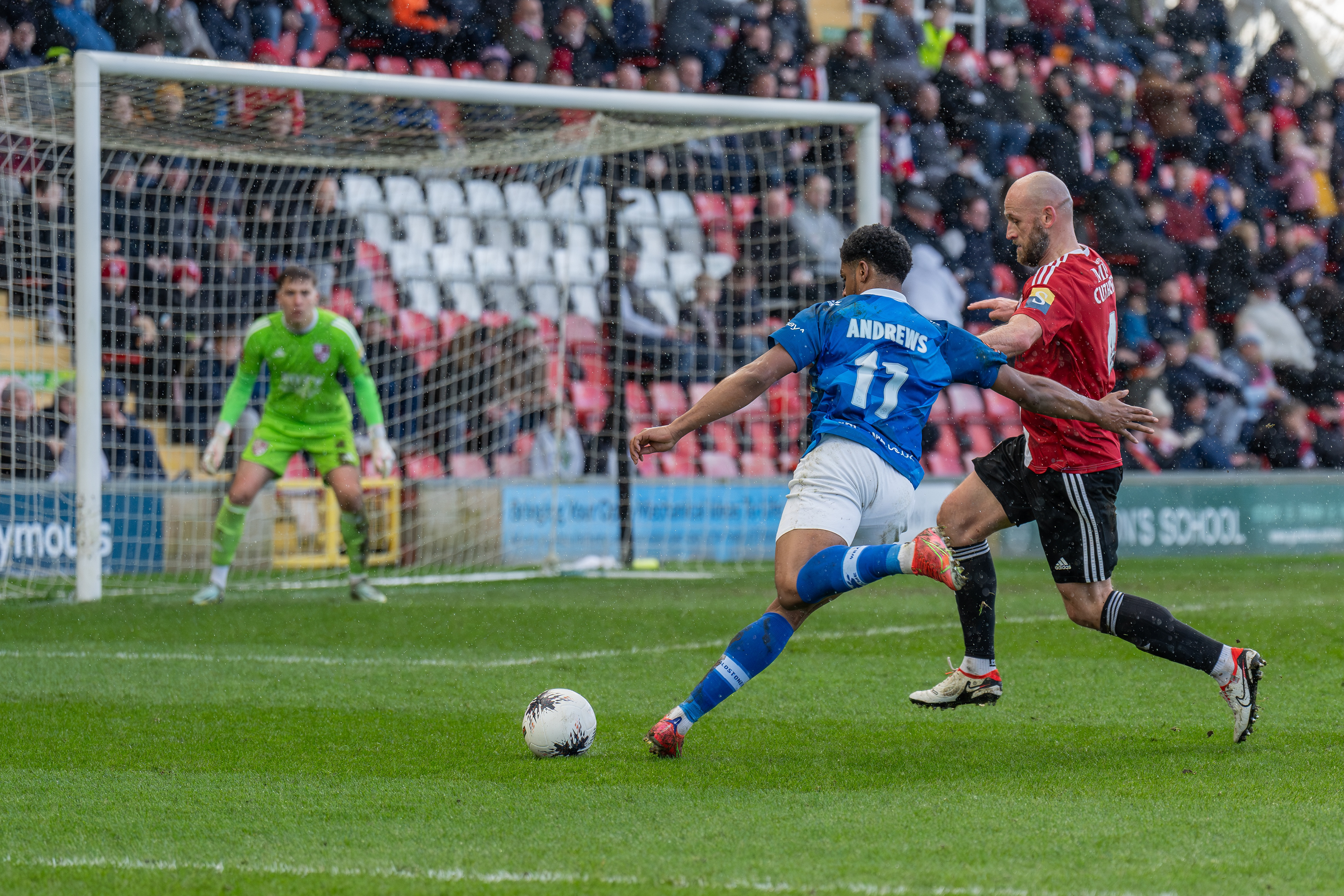 Corie Andrews drives into the Woking box......