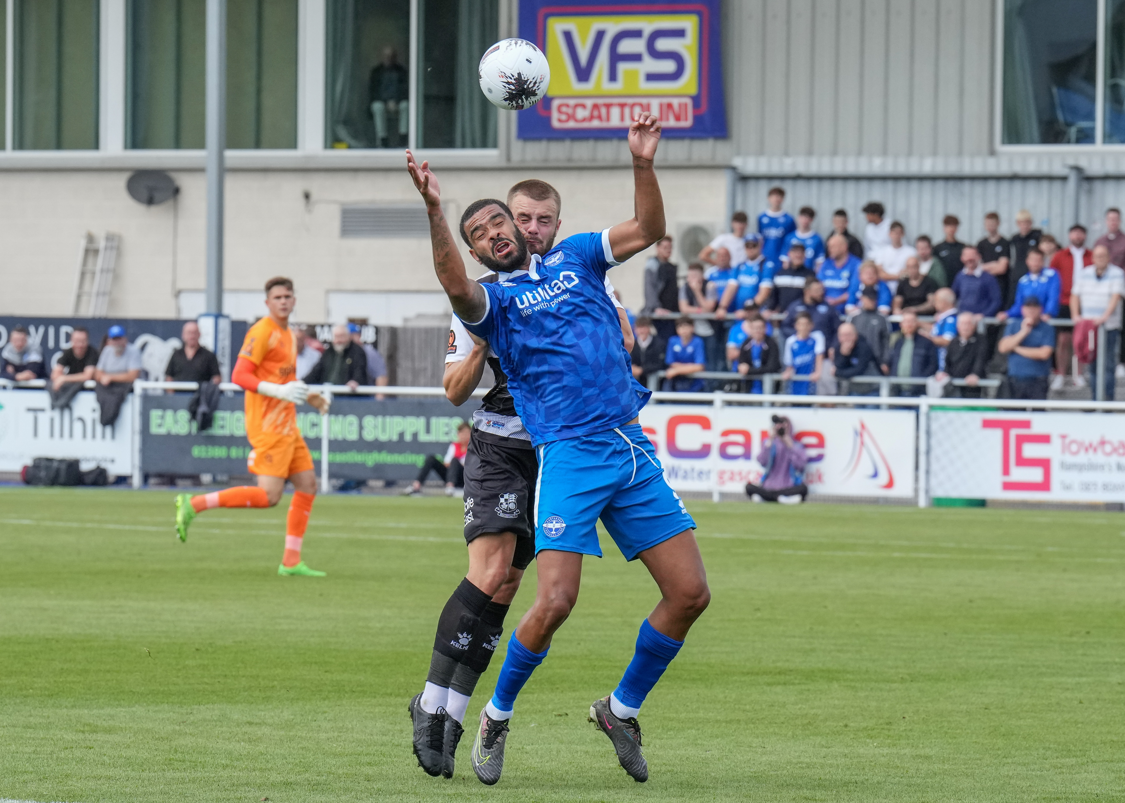 Barker and McCallum battle for the ball