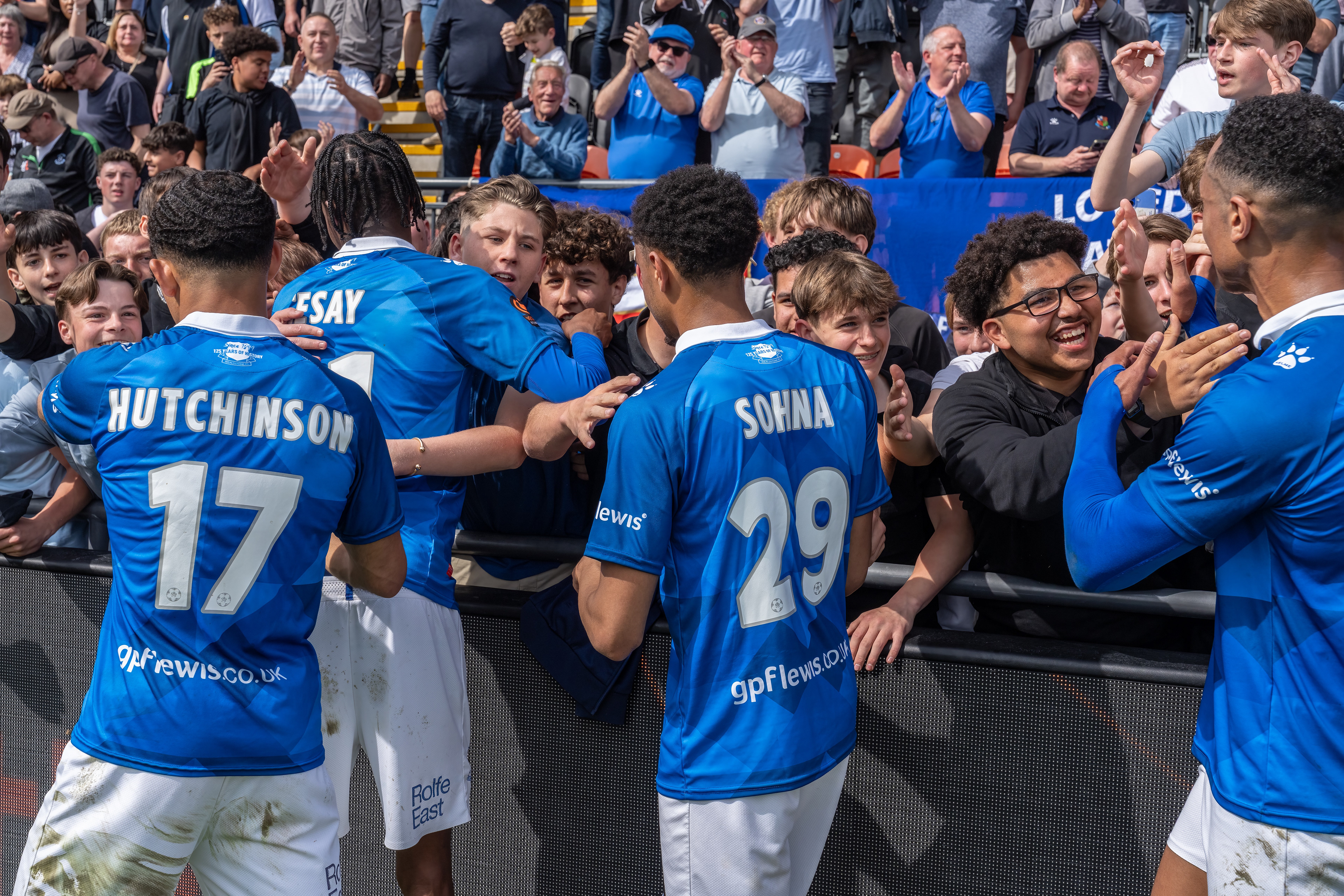 Players celebrate with the fans