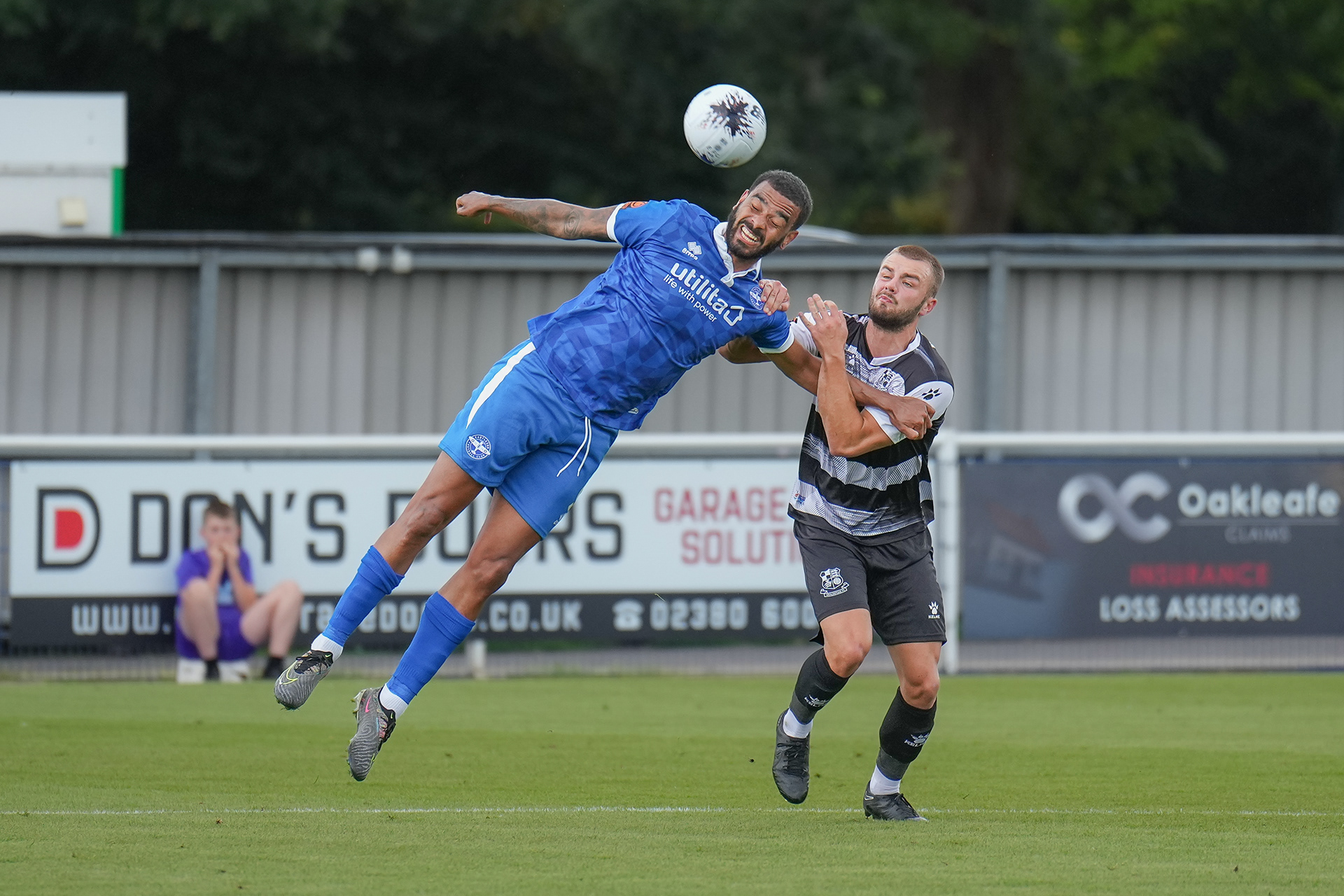 Eastleigh's McCallum and Charlie Barker battle for the ball