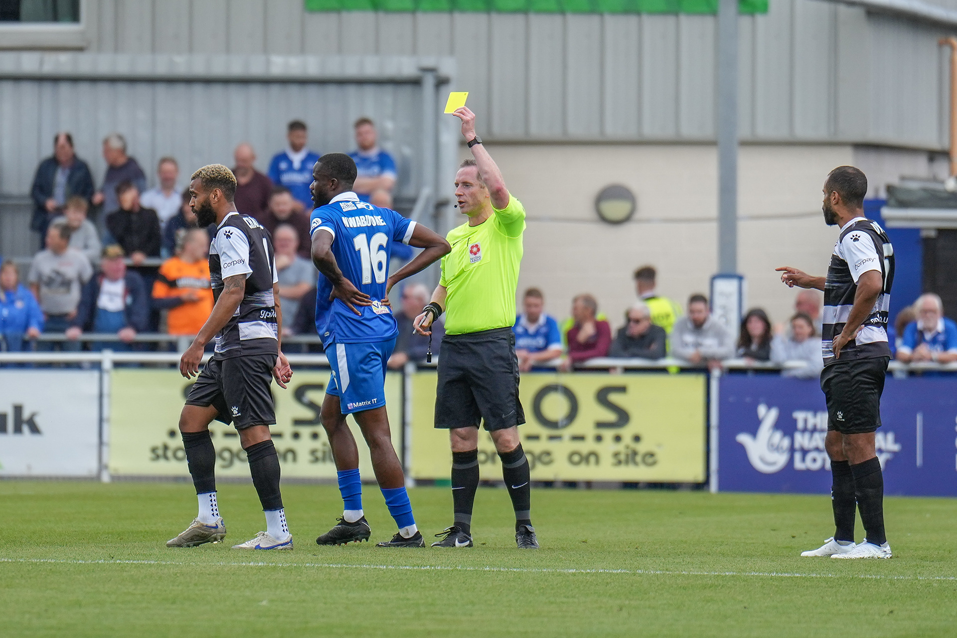 Card happy ref brandishes the first of 8 yellows!