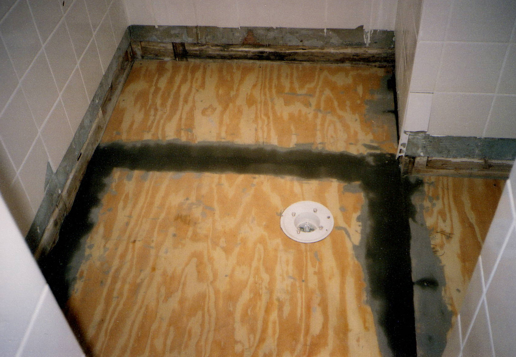 Next step: new subfloor with drain moved