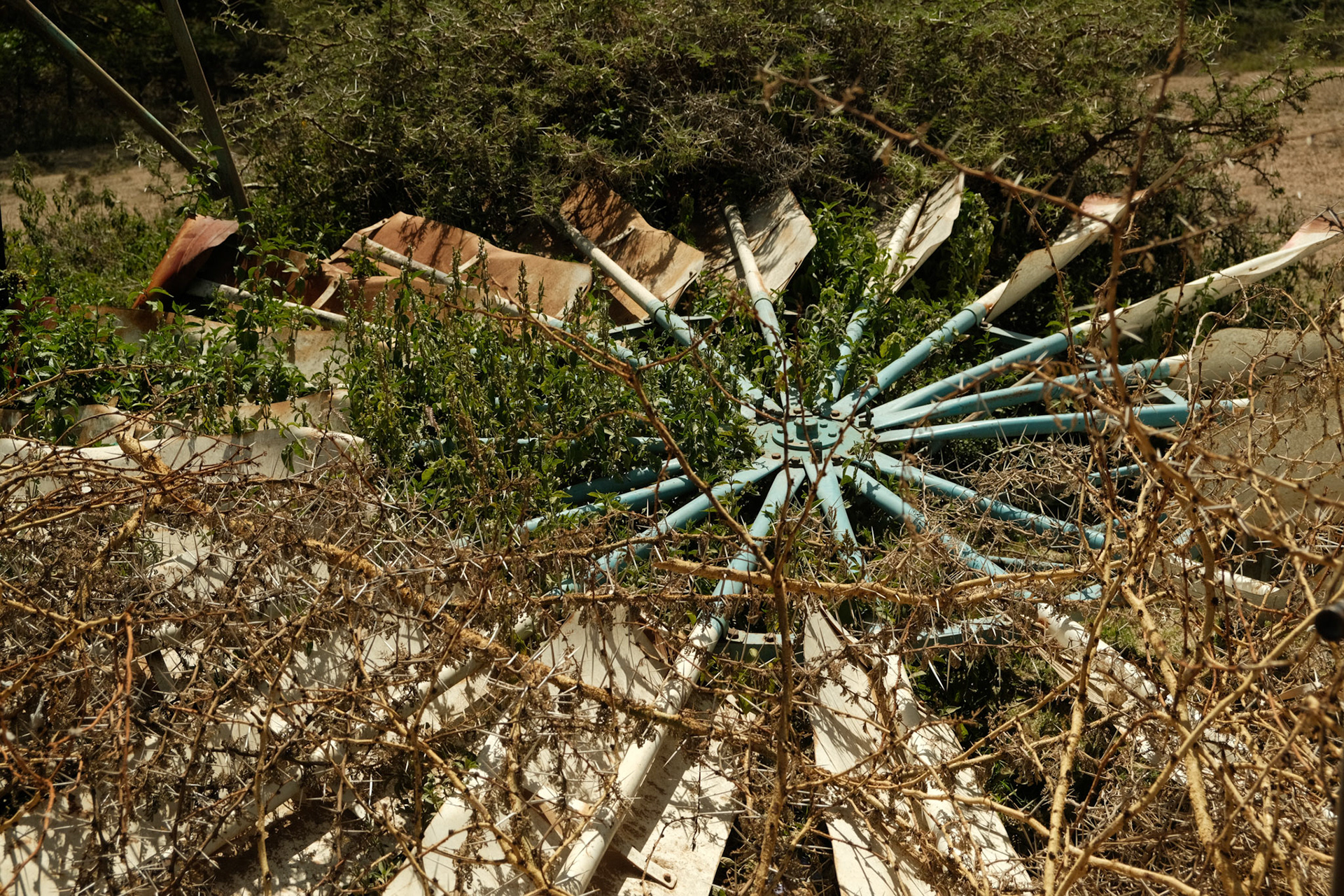 The broken windmill of the water pump used to irrigate fields nearby