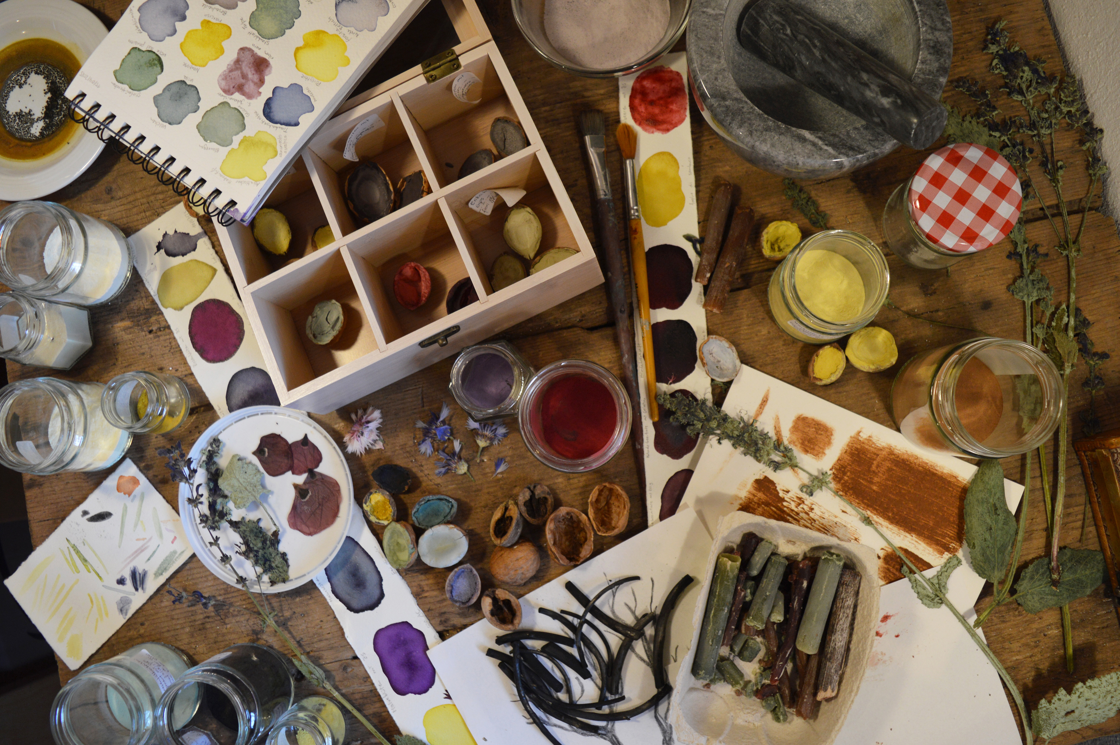 atelier table full of handmade colours
