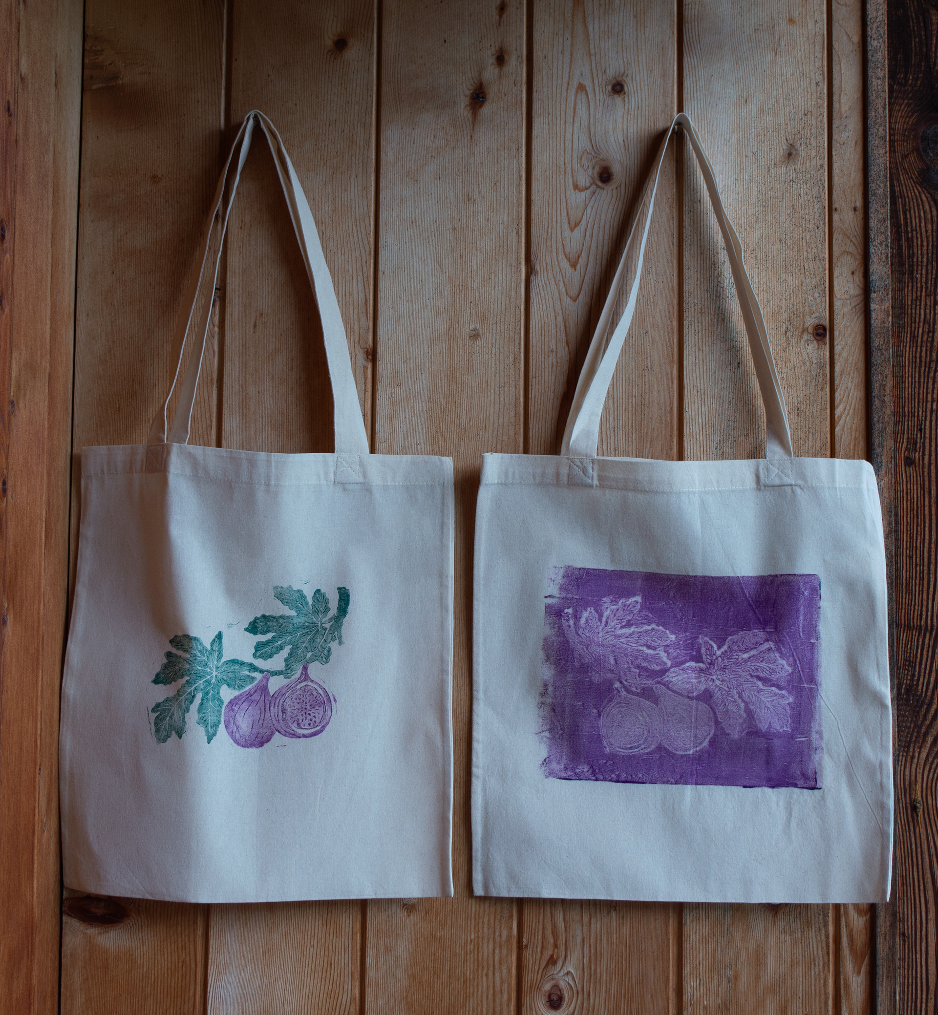 two-colour linoprint and negative purple gel-plate-print on tote bags