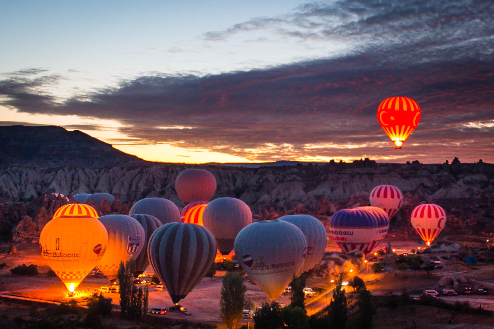 first hot air balloon to lift off. dawn, kapadokya, turkey.