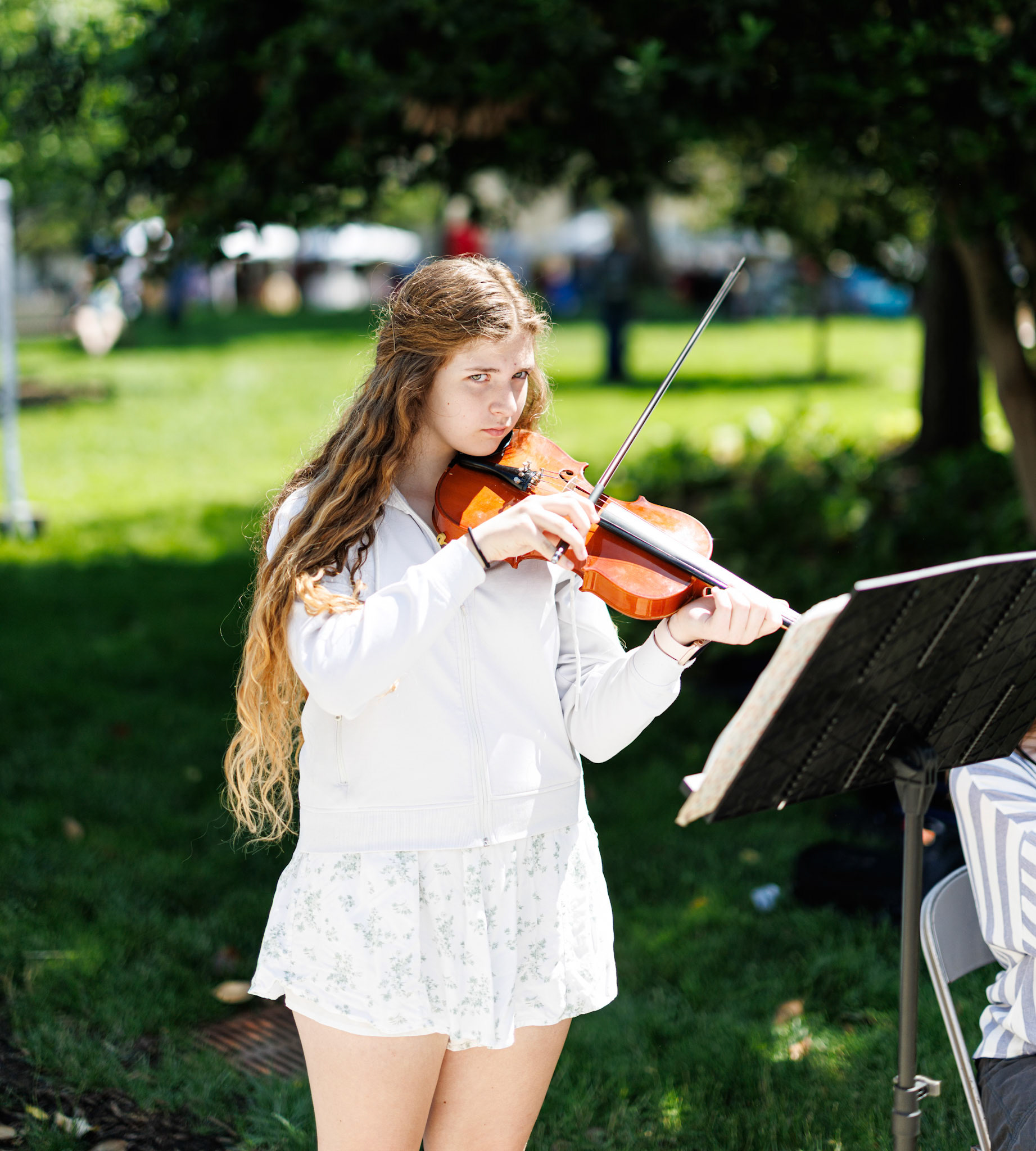 Girl playing fiddle during a demonstration at Vandalia Festival 2025