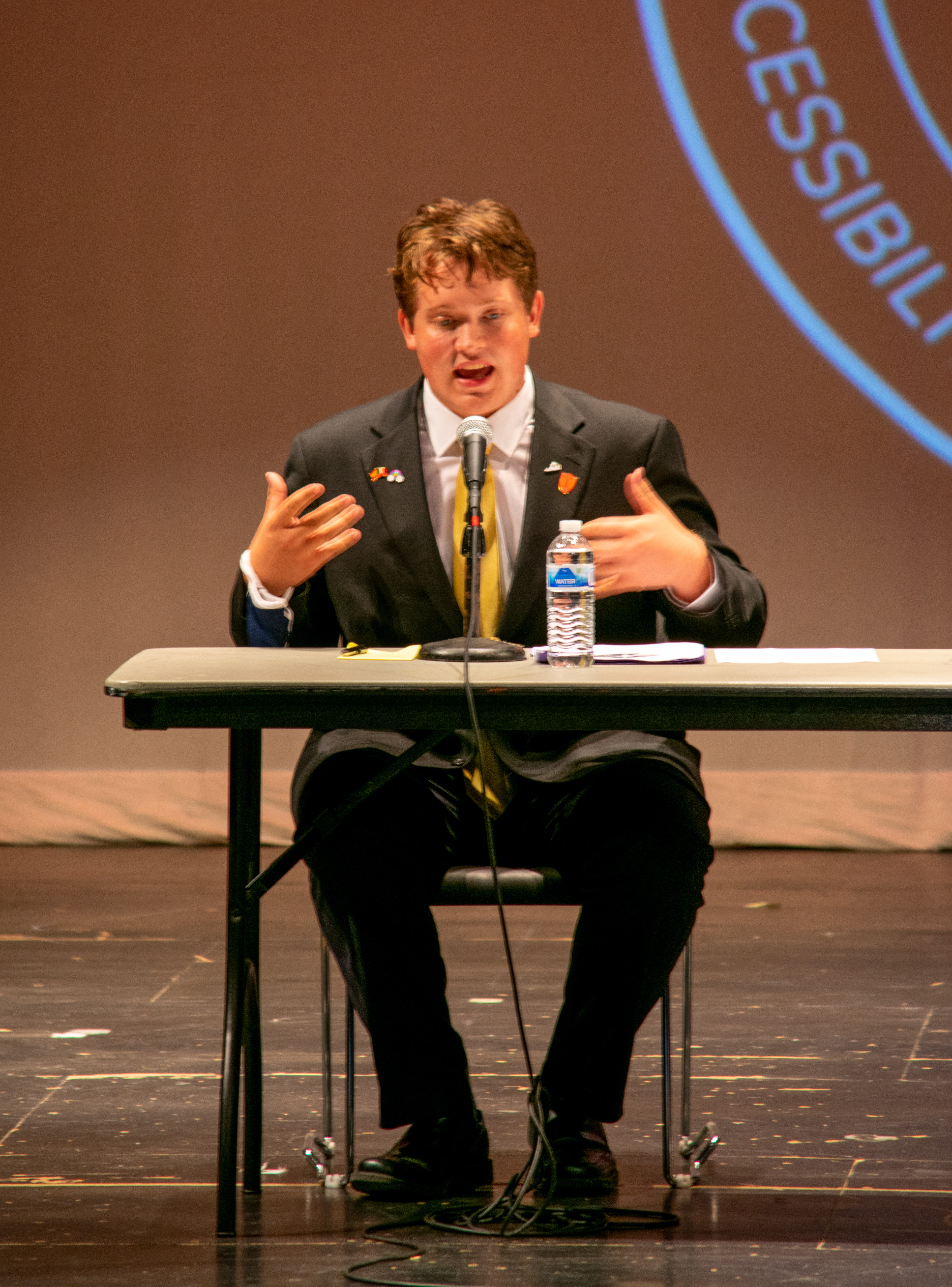 Virginia Tech Undergraduate Student Senate candidate, Charlie Sloop, passionately explaining his platform slogan, “Infinity Loop with Sloop”, during the Student Senate debate in the Haymarket Theatre, on October 13, 2021.