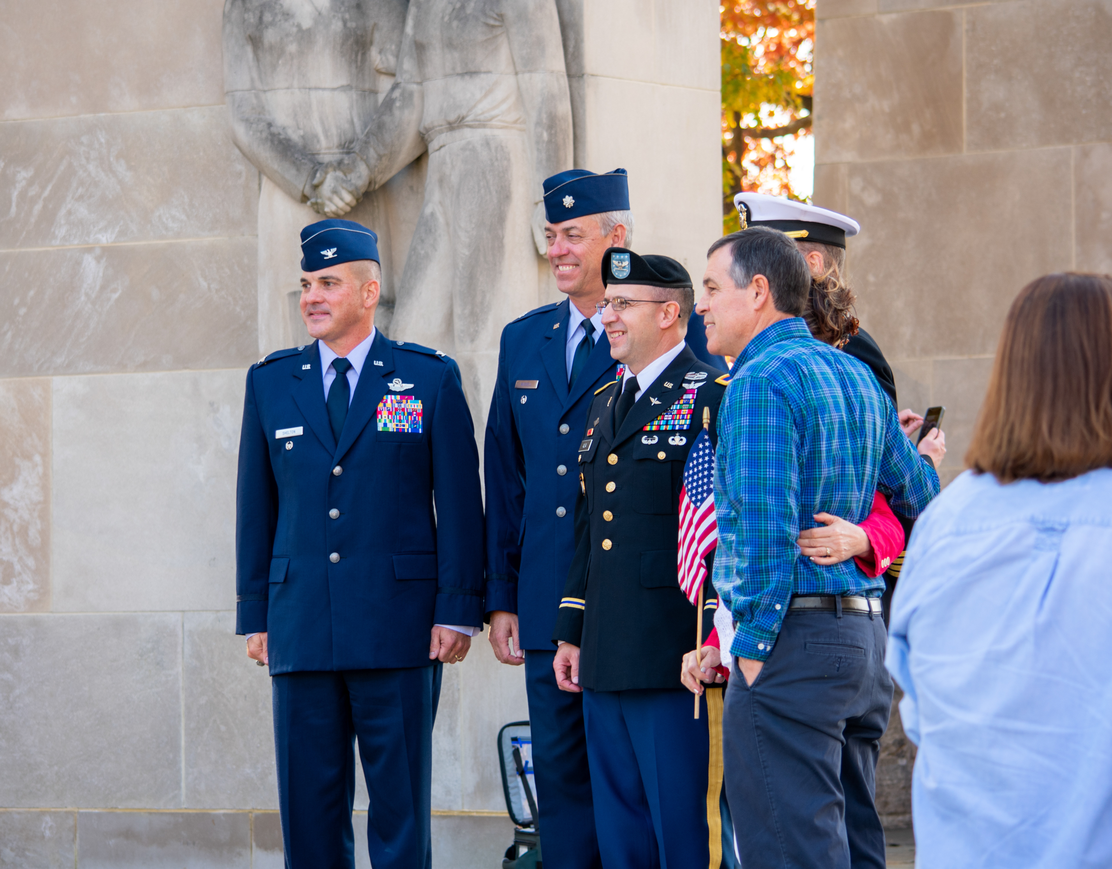 Col Robert Shelton, Deputy Commandant for 3rd Battalion, left, with Lt Col Don Russell, Deputy Commandant for 2nd Battalion, and COL Craig J. Alia, Deputy Commandant for 1st Battalion, right, smiling for a photograph with a Virginia Tech Cadet and his family at the university’s Veterans Day remembrance service on November 11, 2021.
