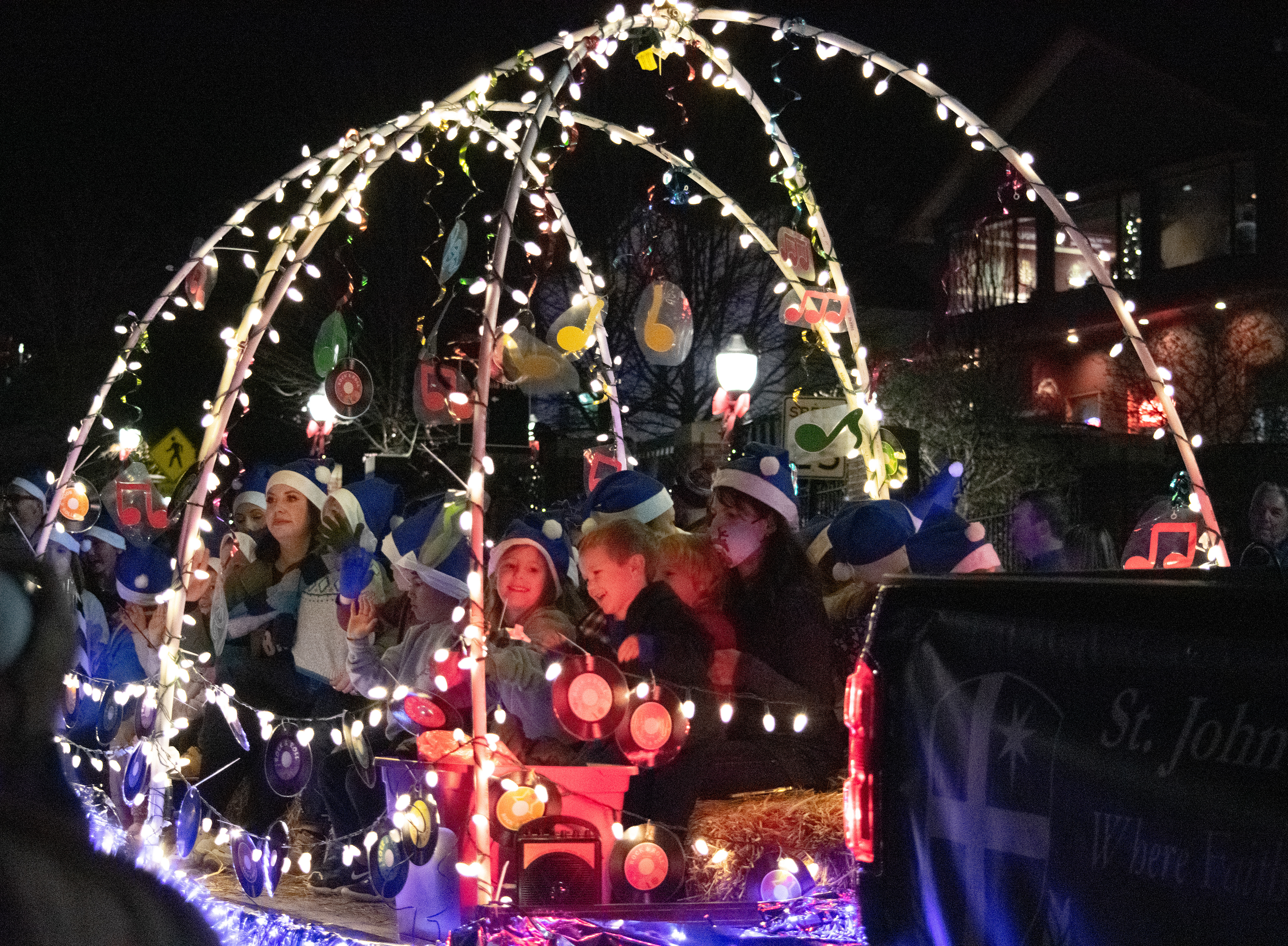 A 3rd-grade music class from St. John Neumann Academy singing holiday carols as they parade their way down Main St. on December 3rd, 2021