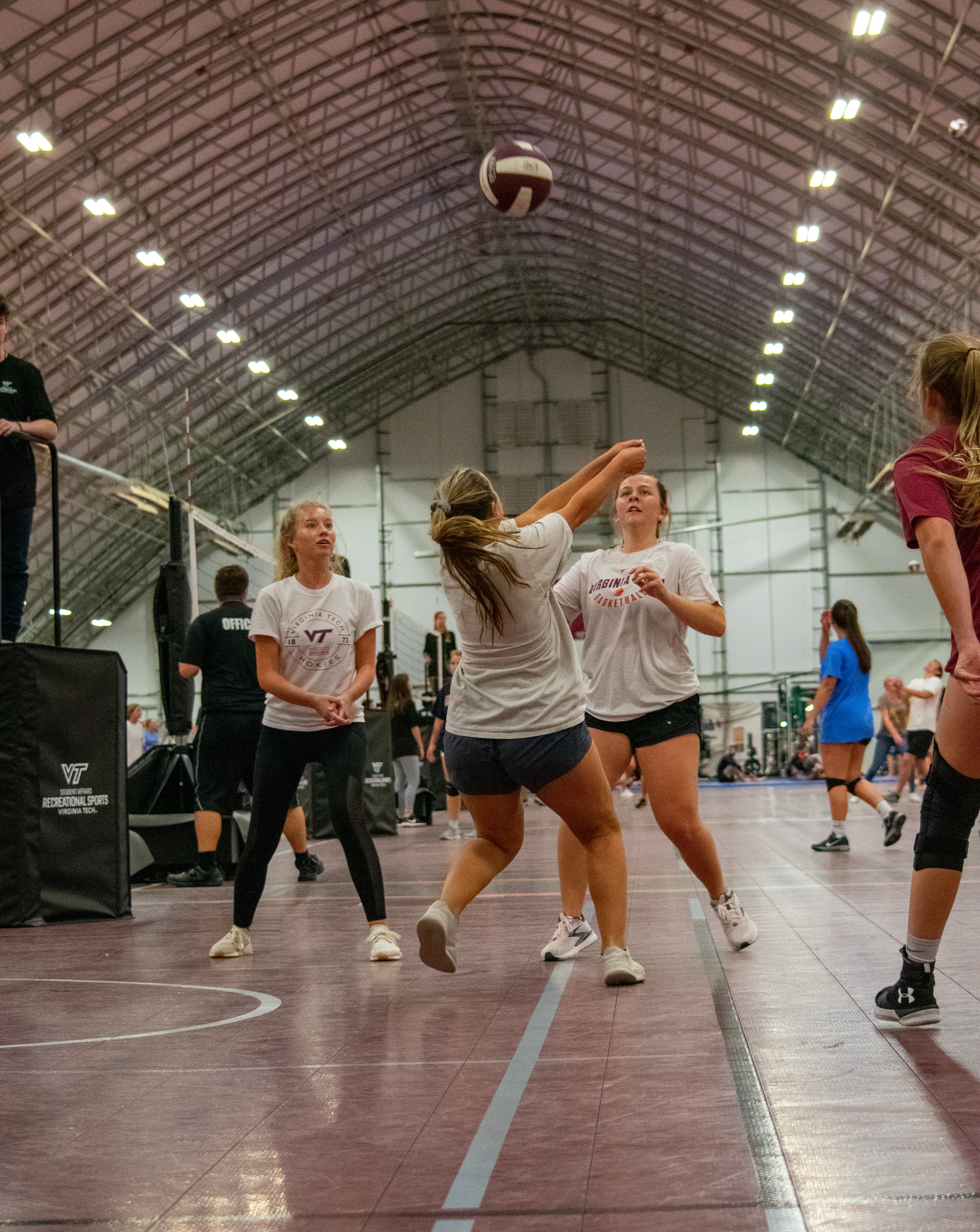 A junior on the "Foxridge Girls" returning a serve backwards during the Virginia Tech intramural volleyball game on October 26th, 2021 in Blacksburg, VA.
