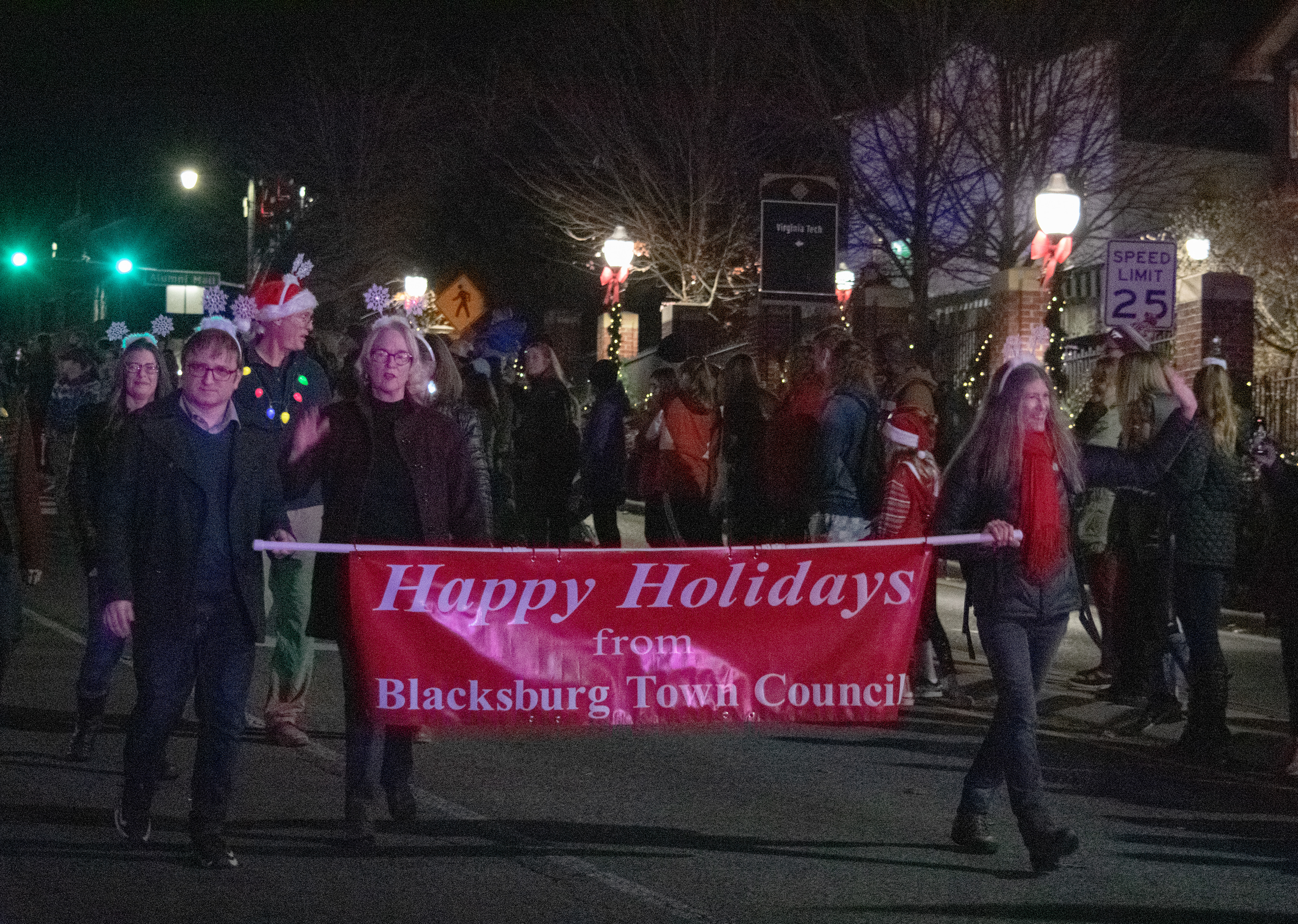 Members of the Blacksburg Town Council, including Blacksburg’s Vice Mayor, Michael Sutphin, left, Mayor Leslie Hager-Smith, middle, and Town Council member, Susan Anderson, right, opened the Blacksburg Holiday Parade on December 3, 2021.