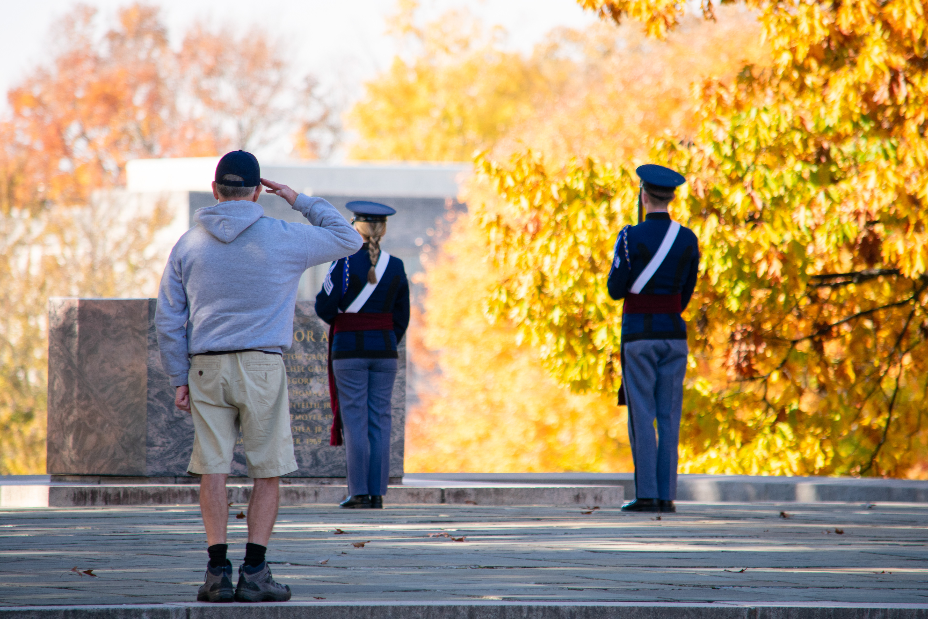 United States Navy Veteran saluting the Corps of Cadets standing watch on War Memorial Court before the Virginia Tech Veterans Day remembrance ceremony on November 11, 2021.