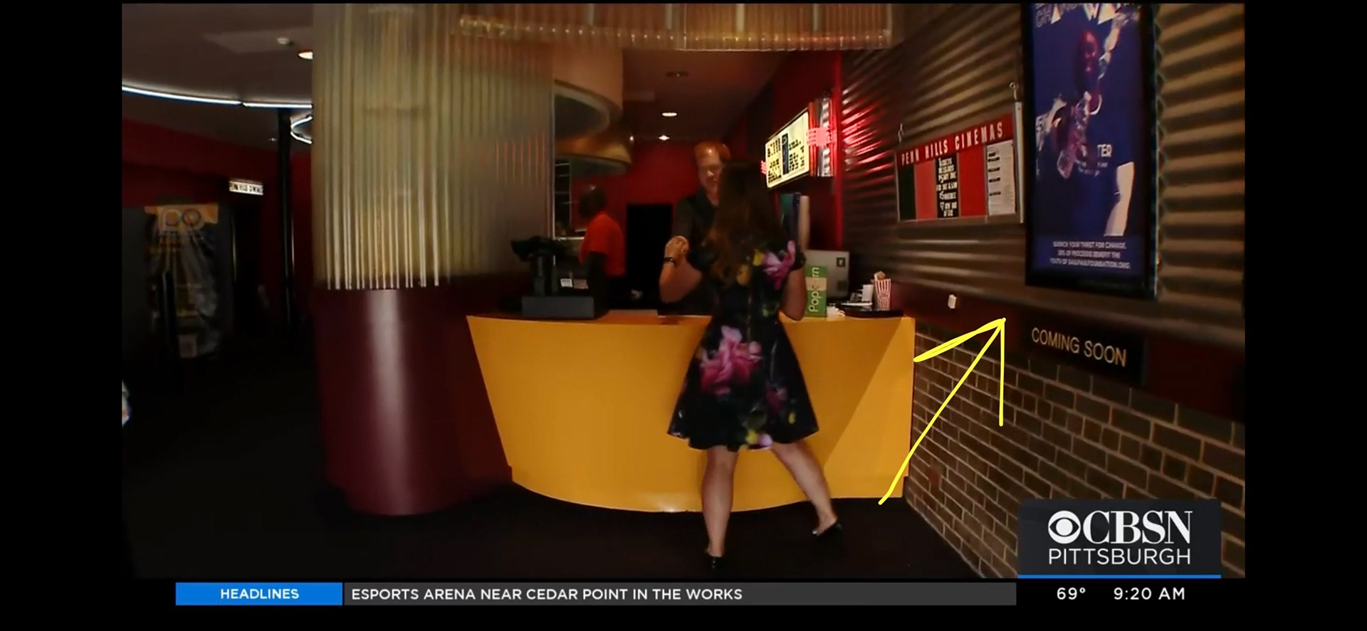 The poster seen hanging on the wall on a live TV news segment