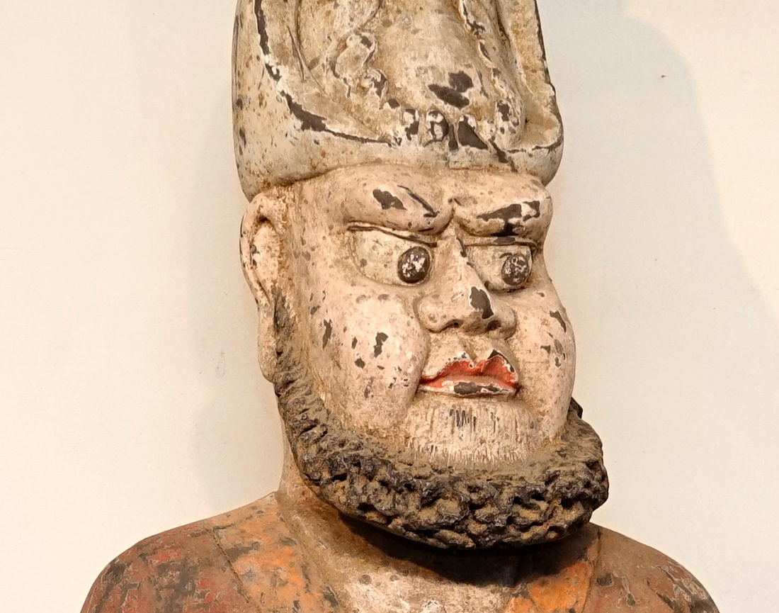 The Wil Farrow Collection - A Large Painted Pottery Model of a Foreigner