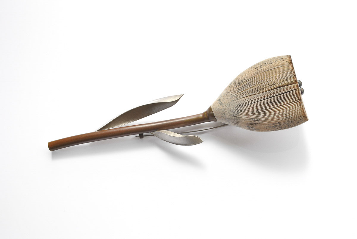 Brooch, 2012; paper, cashew paint, silver, brass, stainless steel