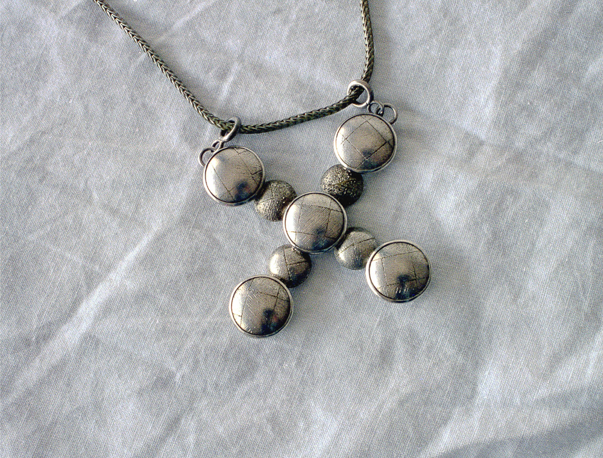 Pendant, 1996; silver, brass, silver foil
