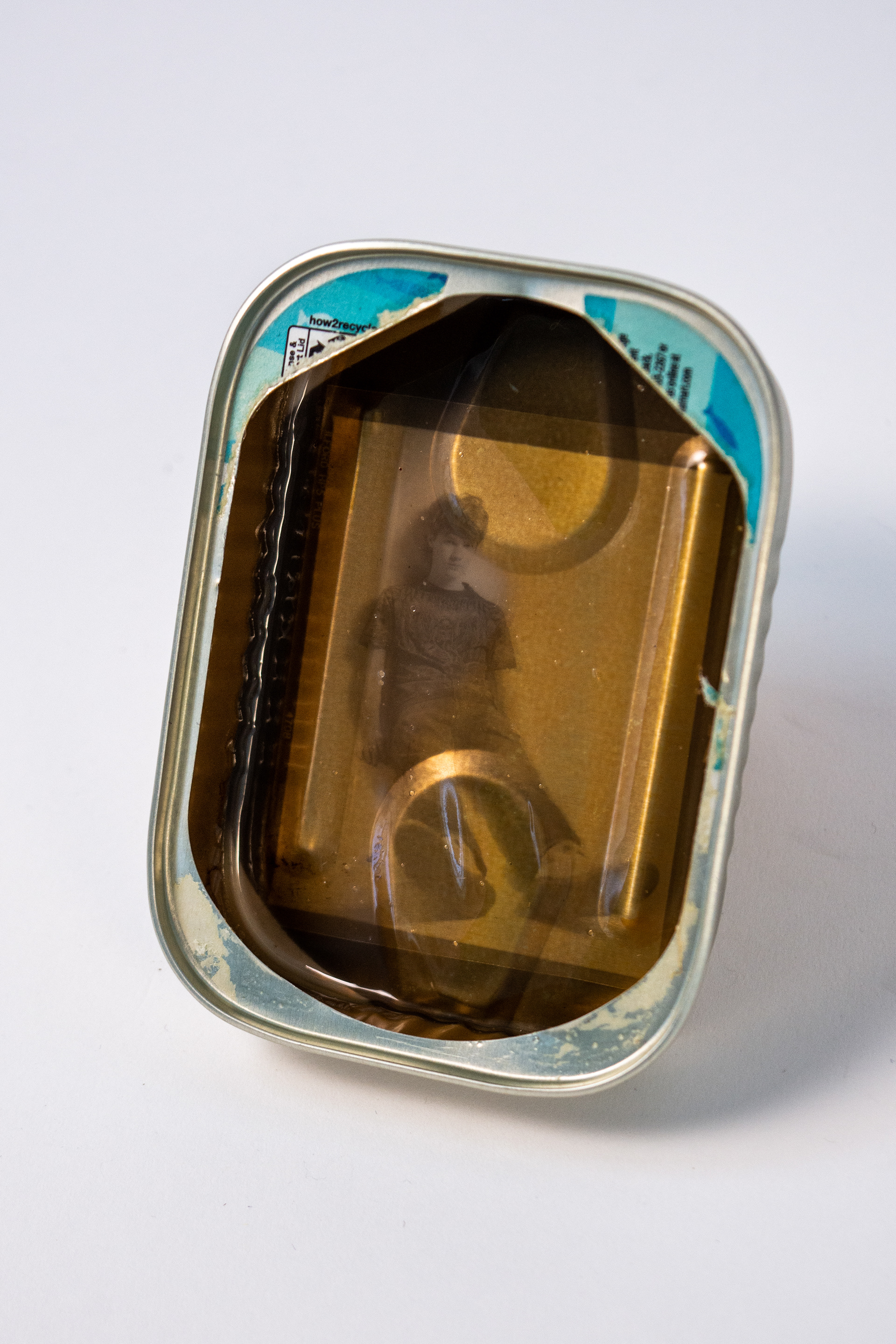 "preservation" 2024 Liquid Light emulsion on Sardine can 4x2x1in