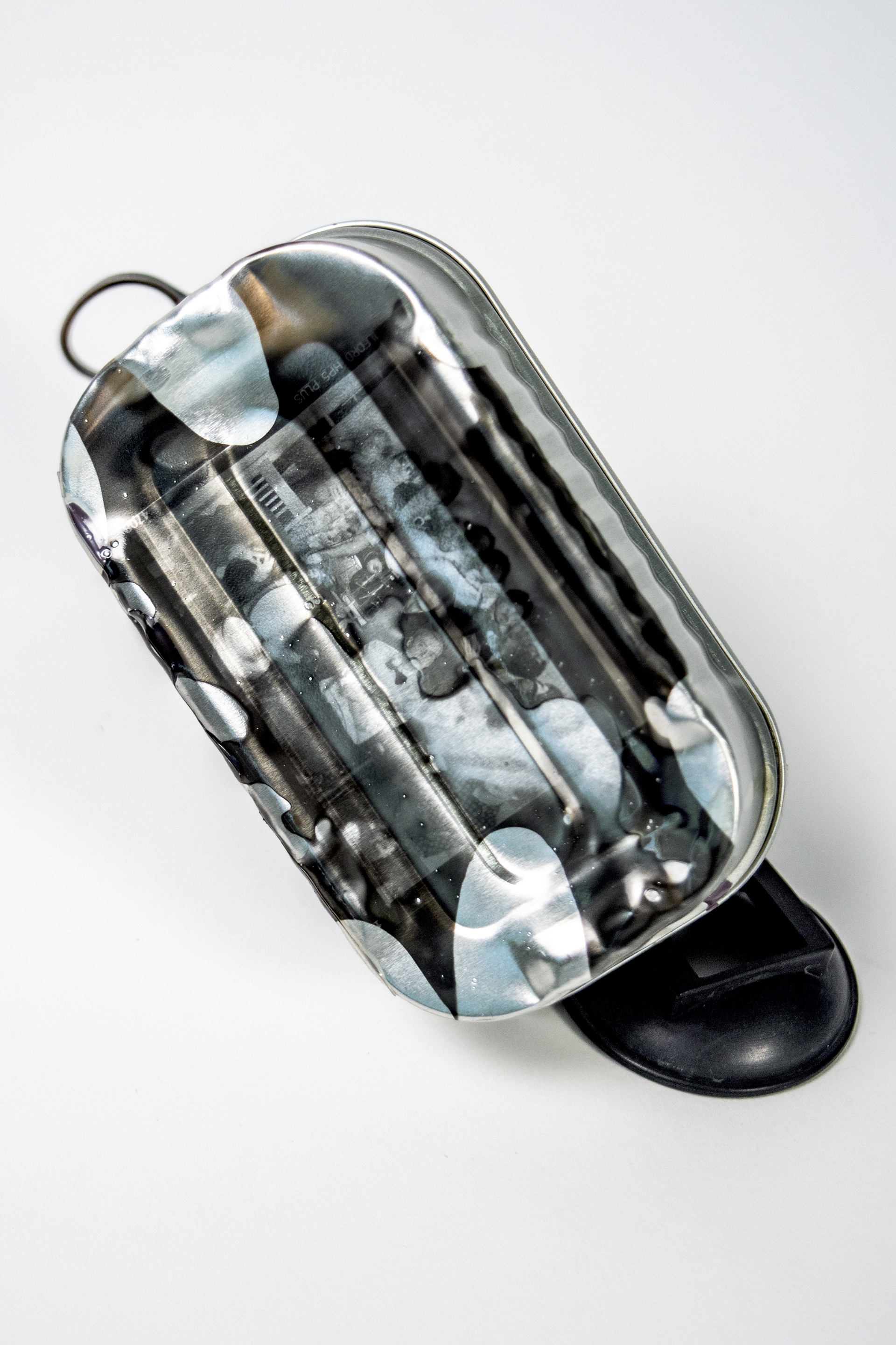 "preservation" 2024 Liquid Light emulsion on Sardine can 4x2x1in